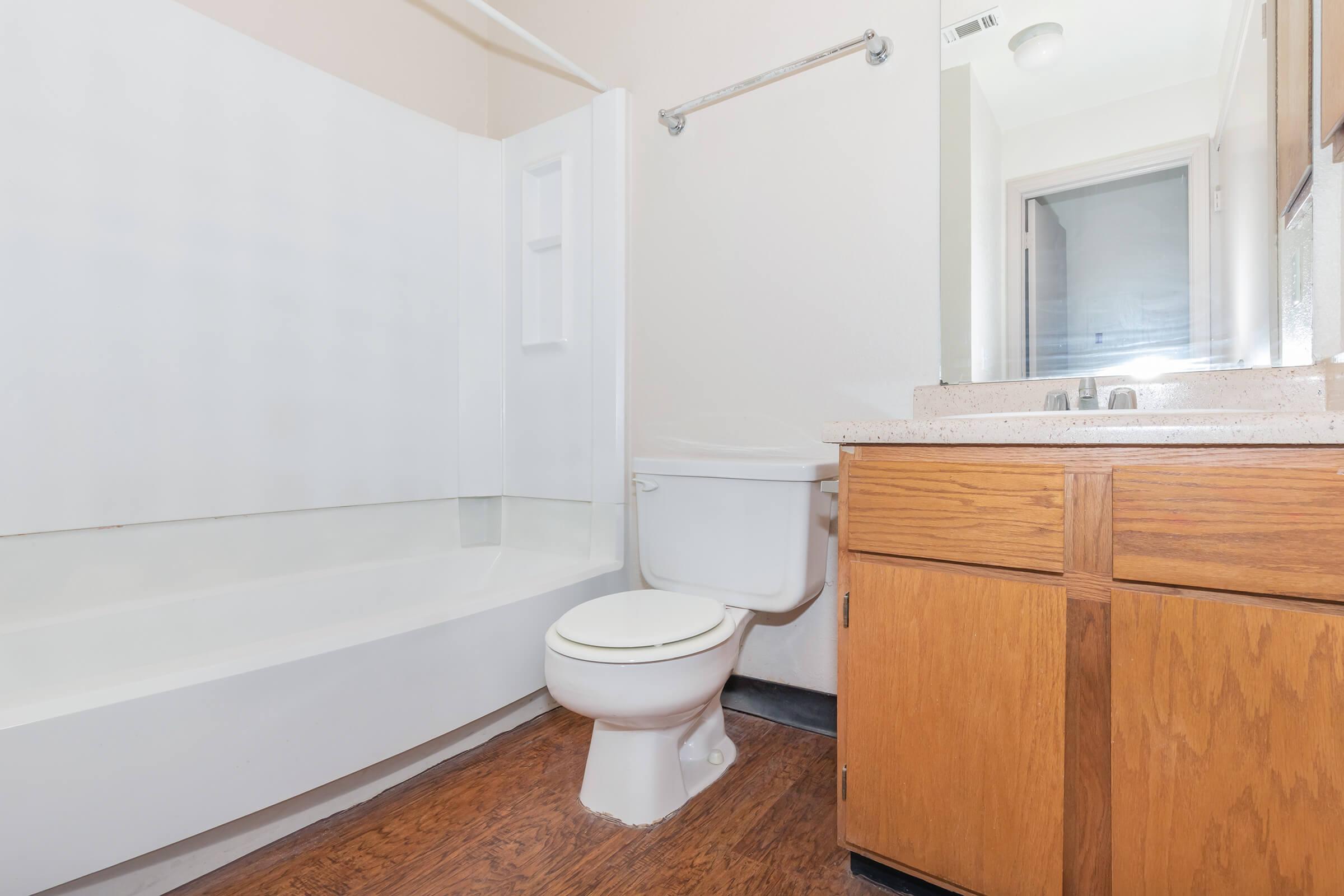 a large white tub sitting next to a sink