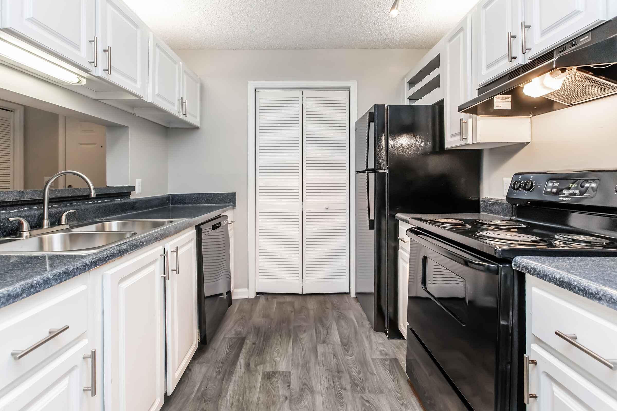 a modern kitchen with stainless steel appliances