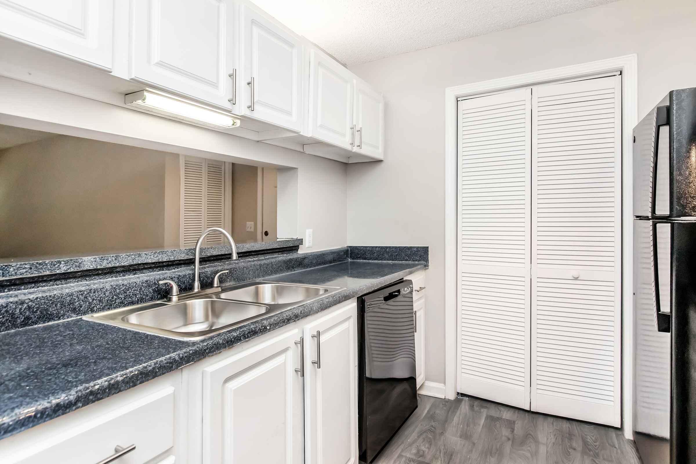 a kitchen with a stove and a sink