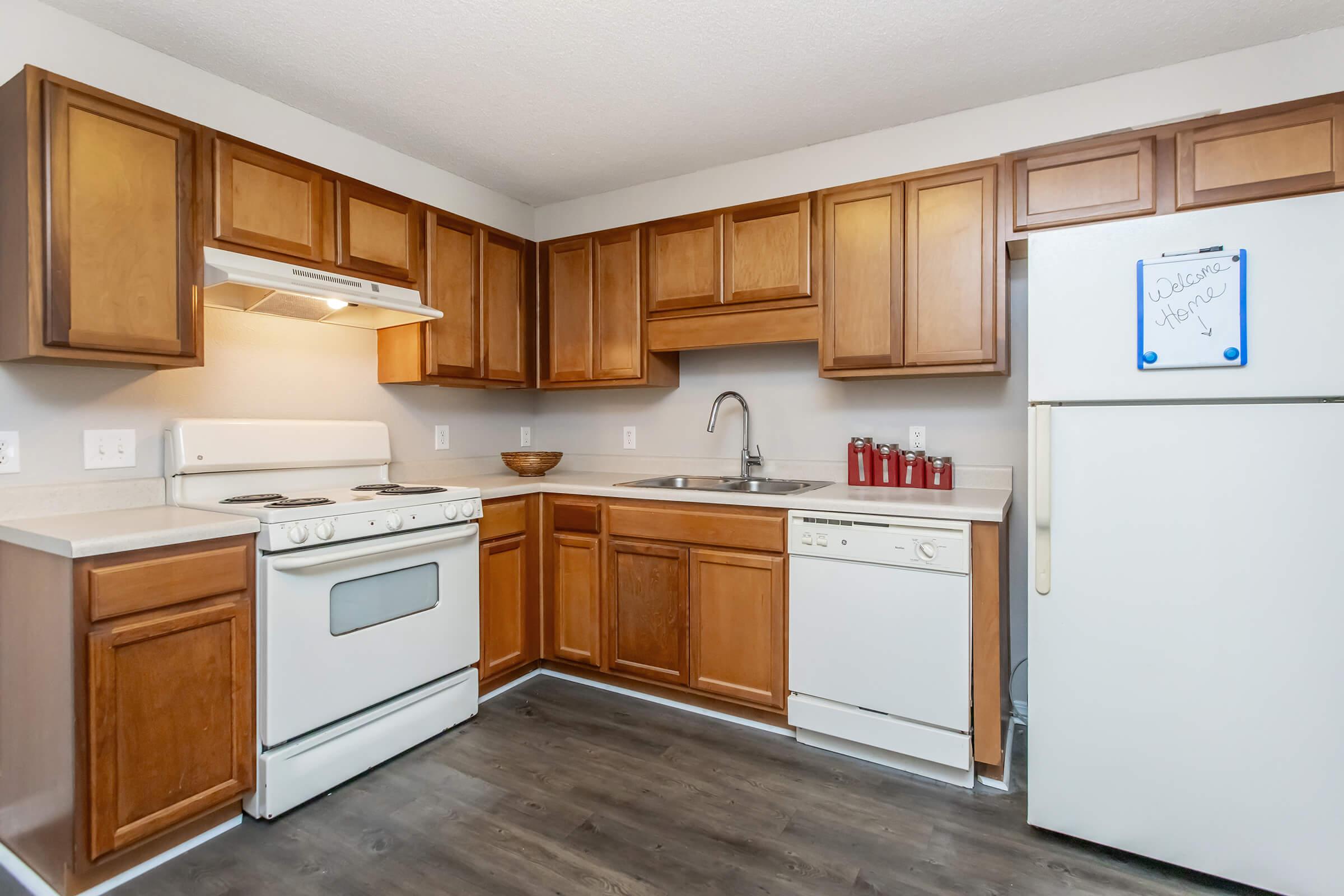 a kitchen with a stove and a refrigerator