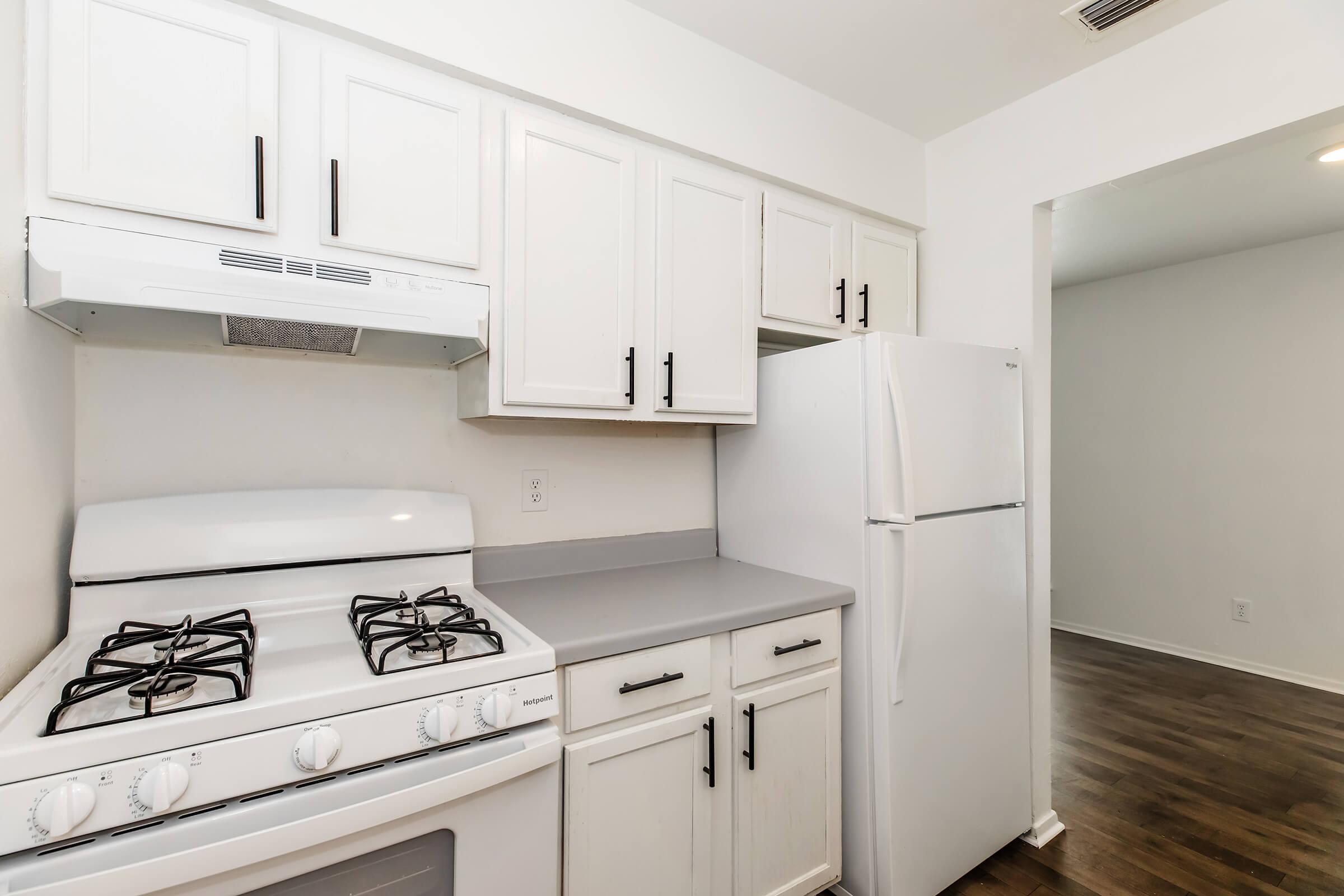 a kitchen with a stove and a sink