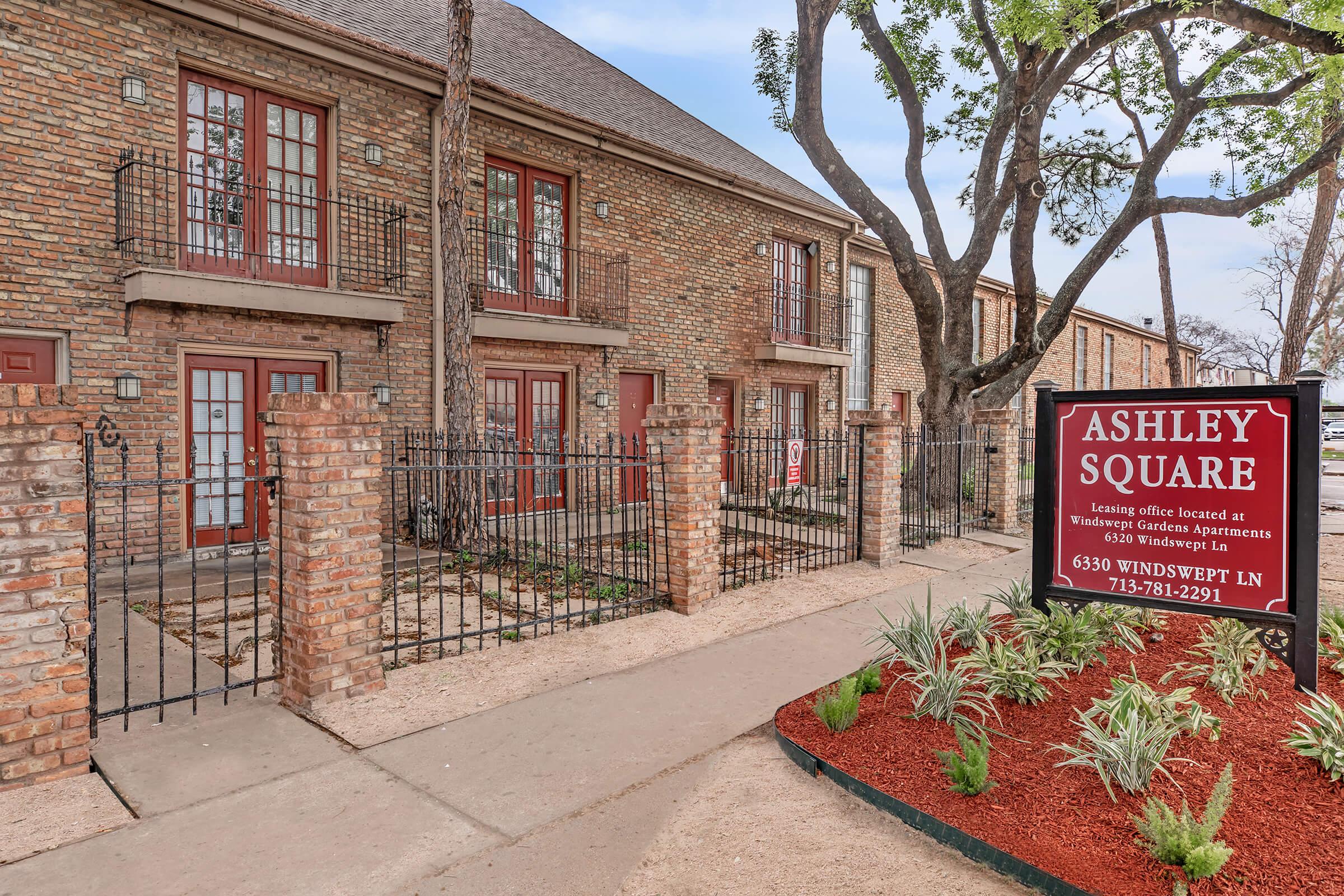 a sign on a brick building