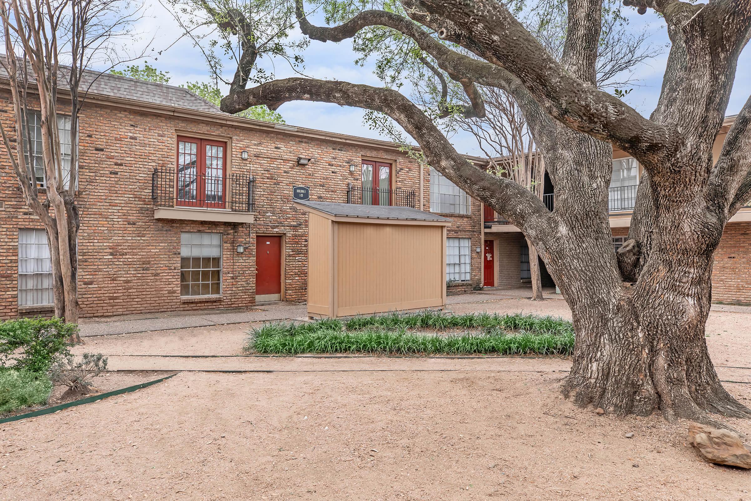 a tree in front of a house