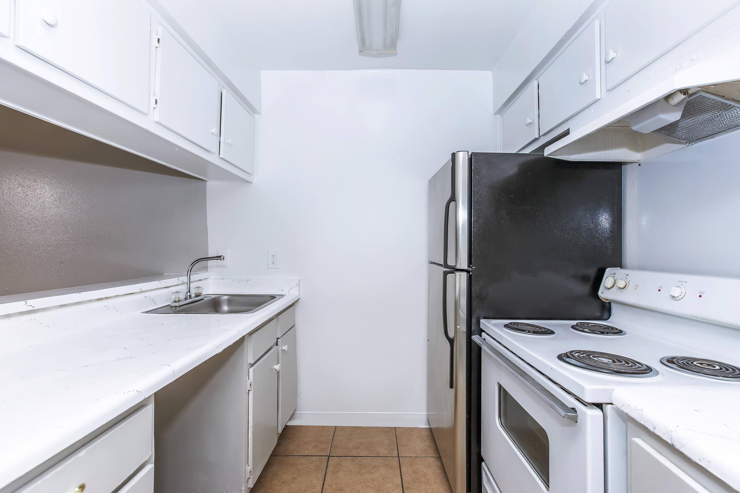 a kitchen with a stove and a sink