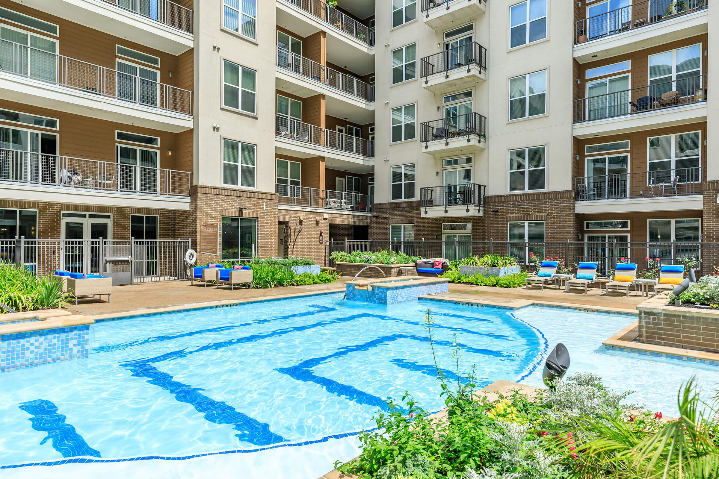 a large pool of water in front of a building