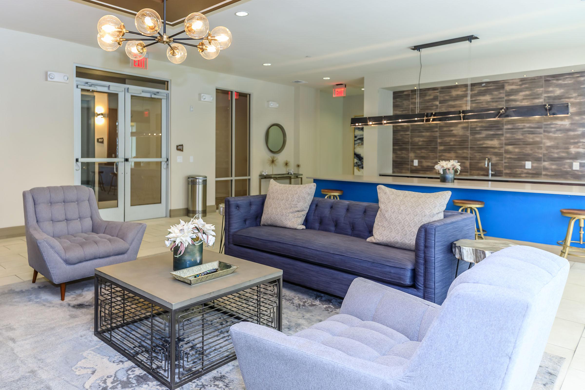 a living room filled with furniture and a fireplace