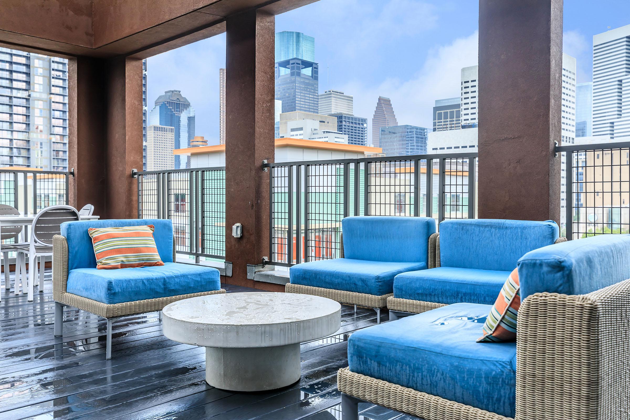 a hotel room with a pool in front of a window