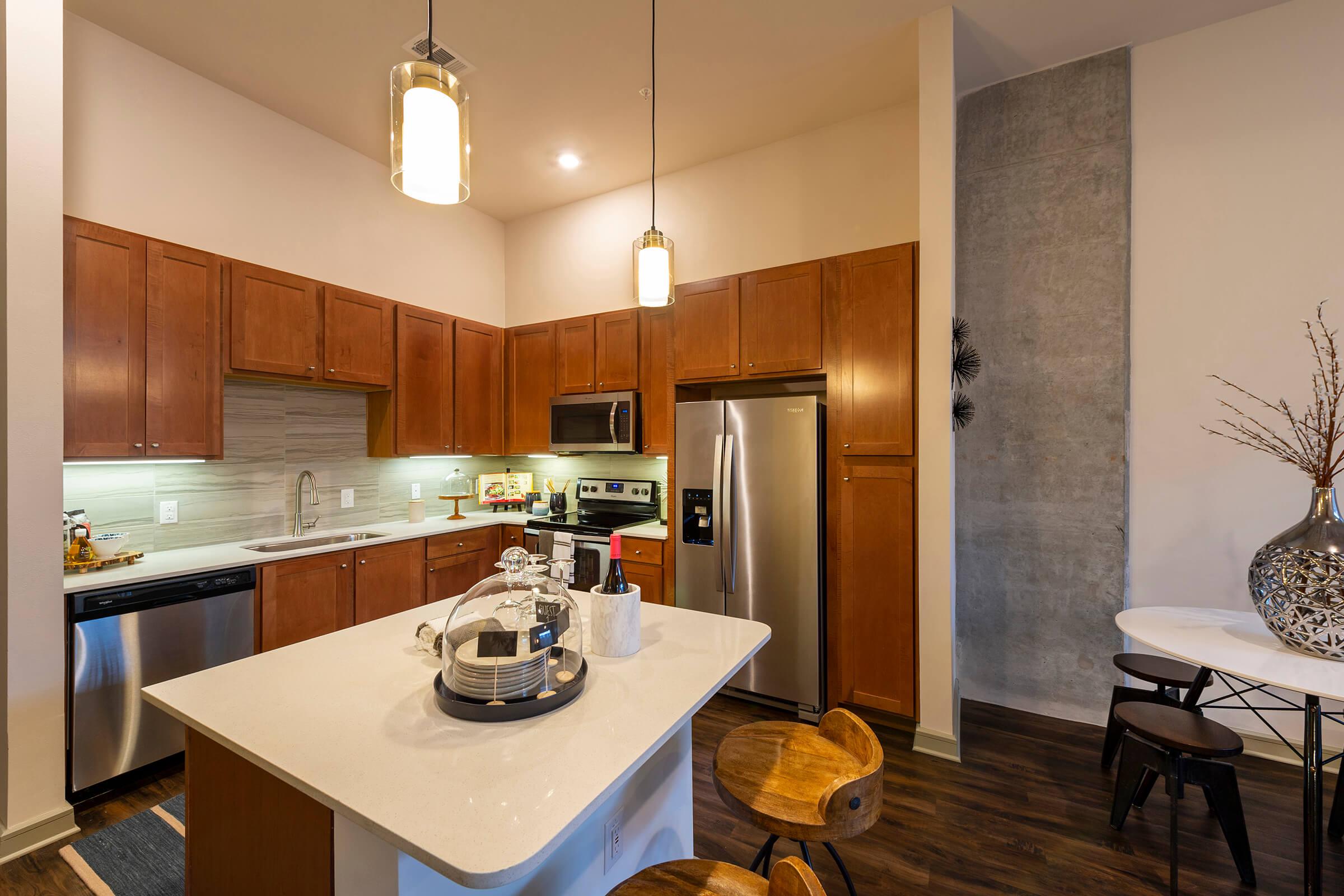 a kitchen with a sink and a mirror