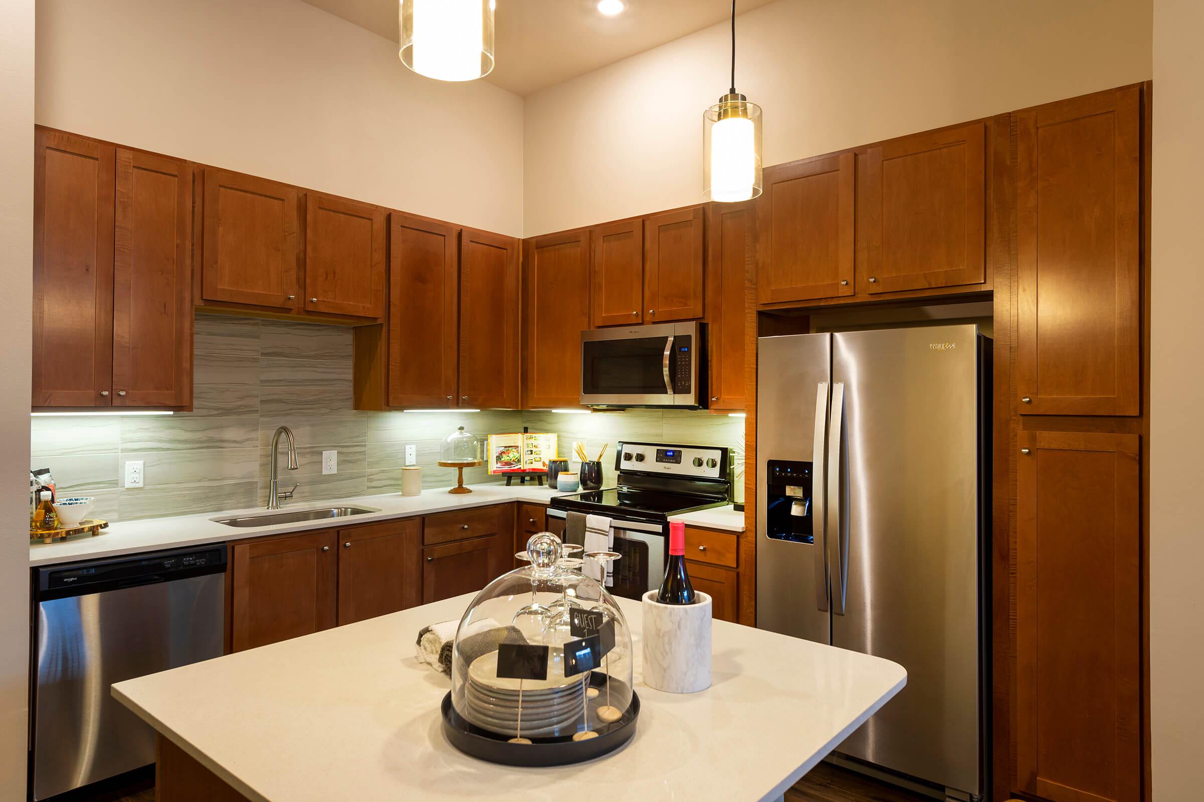 a modern kitchen with stainless steel appliances