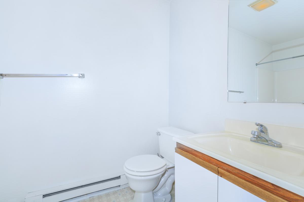 a large white tub next to a sink