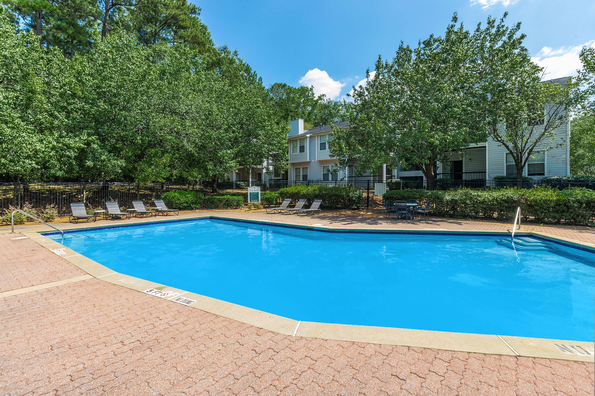 a pool next to a body of water