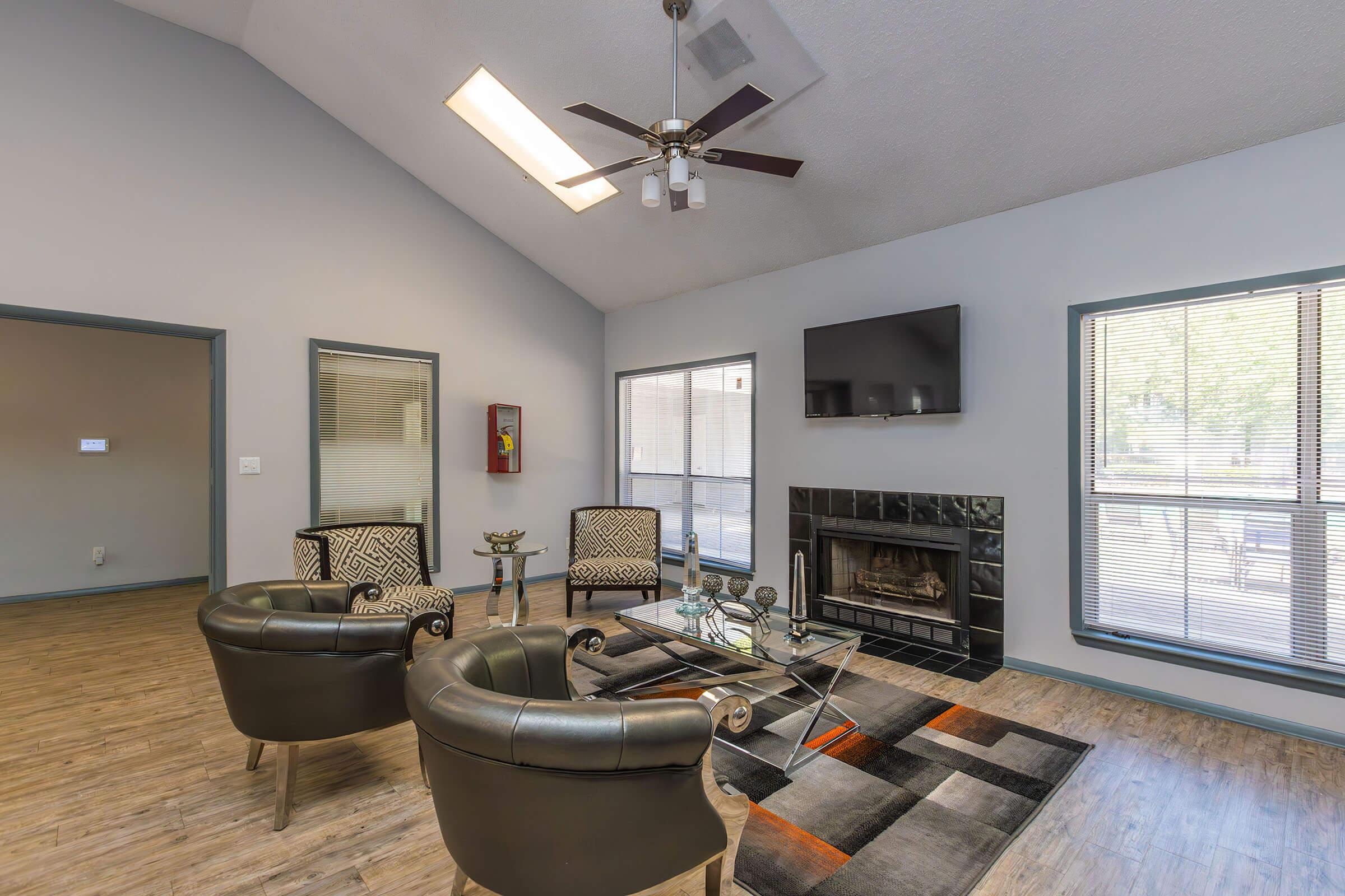 a living room filled with furniture and a large window