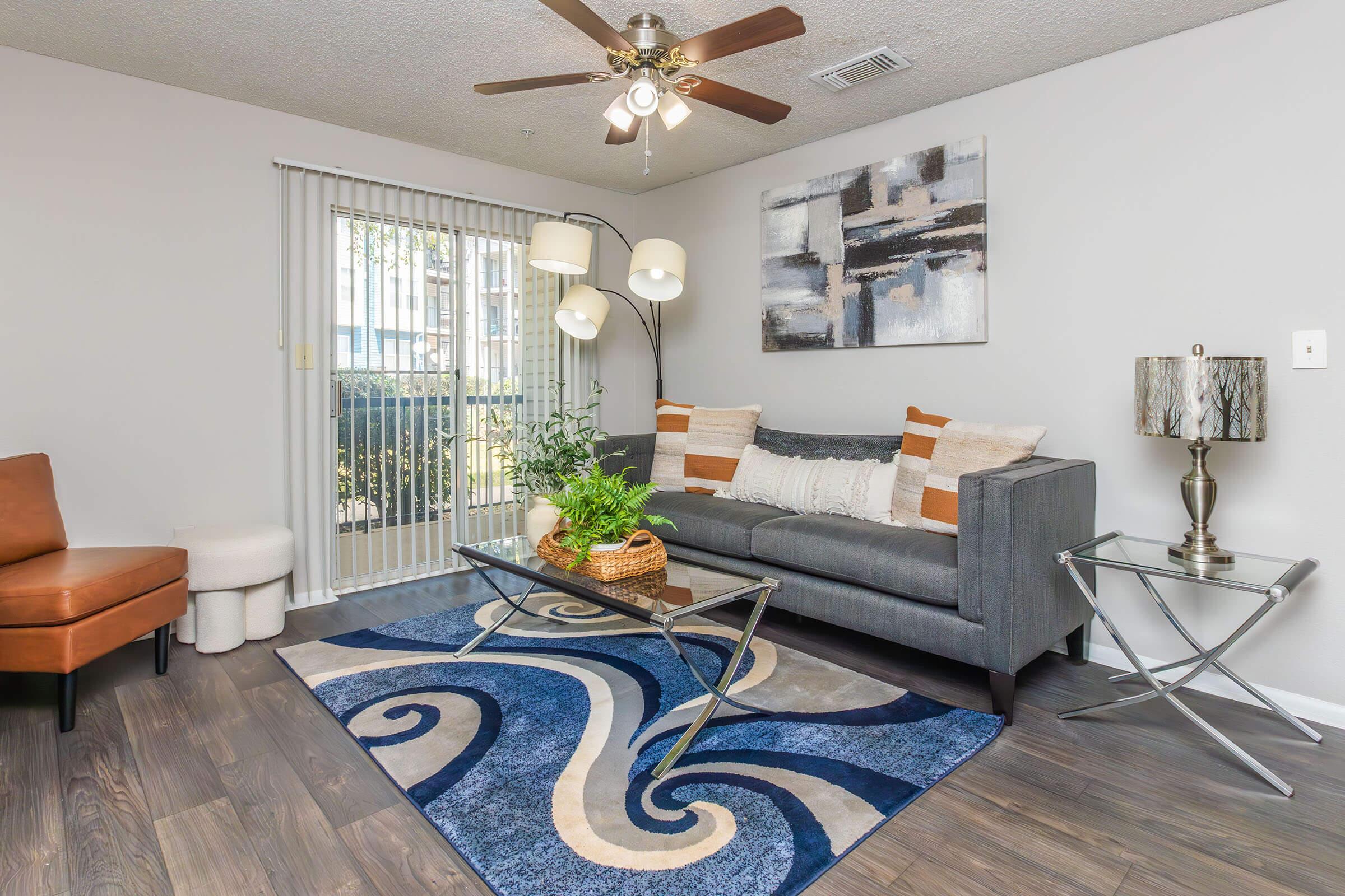 a living room filled with furniture and a fire place