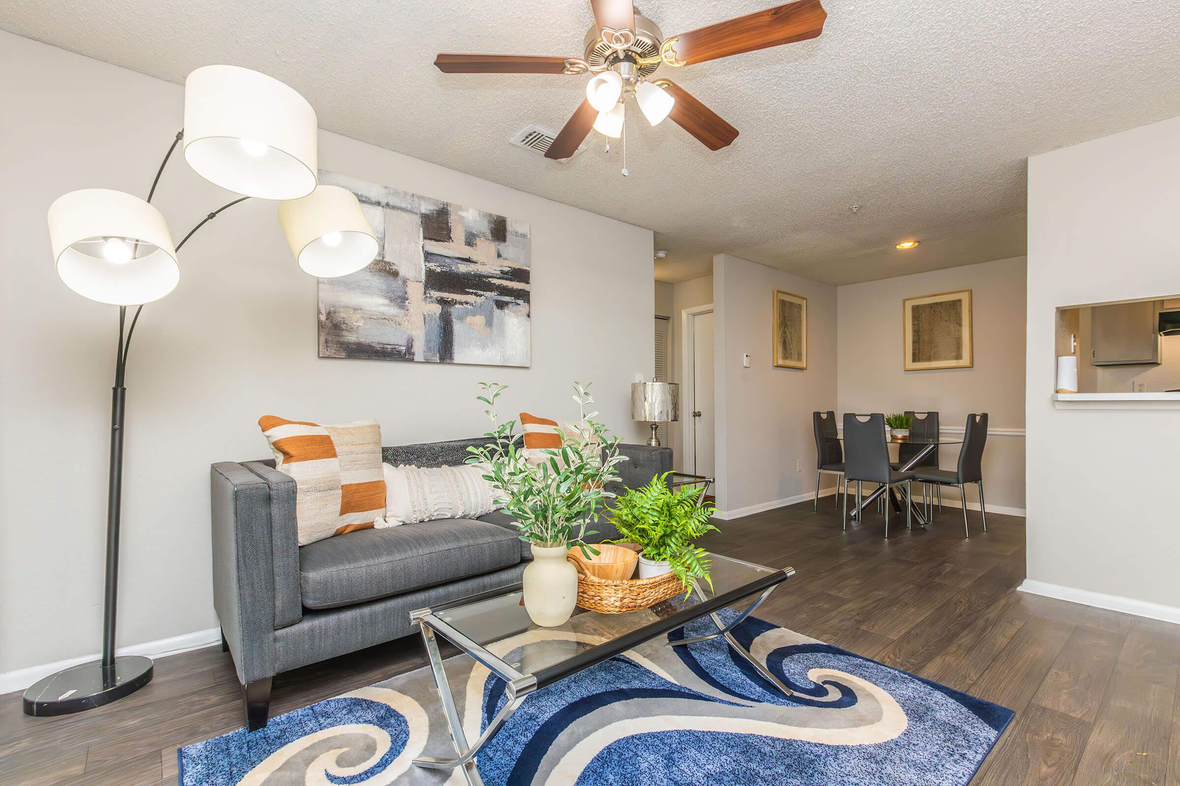 a living room filled with furniture and a table