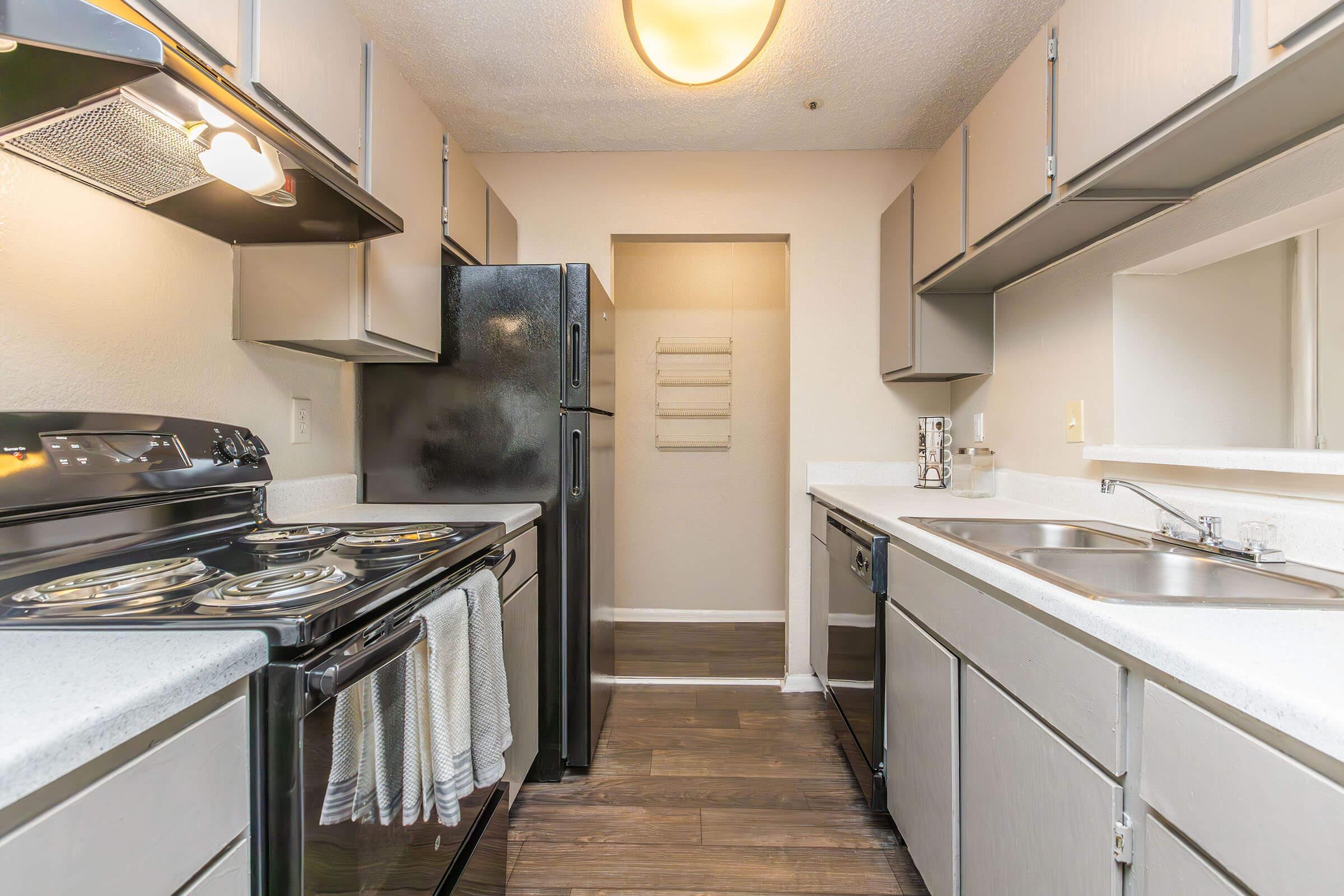 a kitchen with a stove and a sink