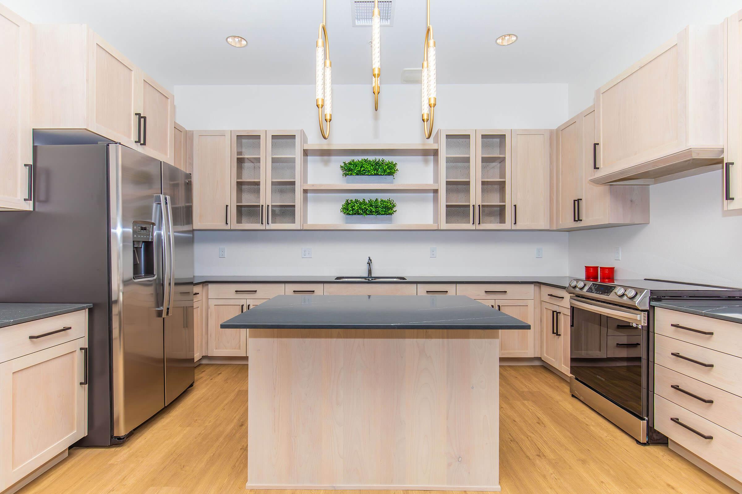 a kitchen with an island in the middle of a room