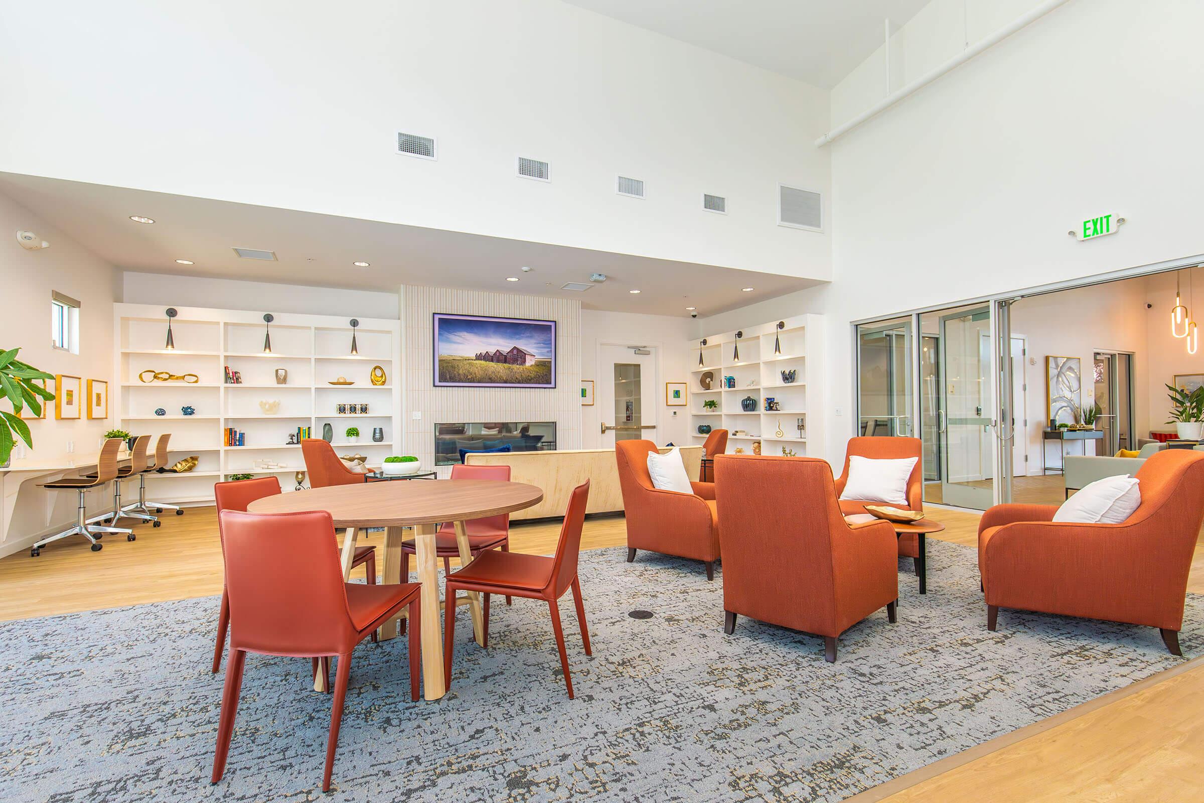 a living room filled with furniture and a rug