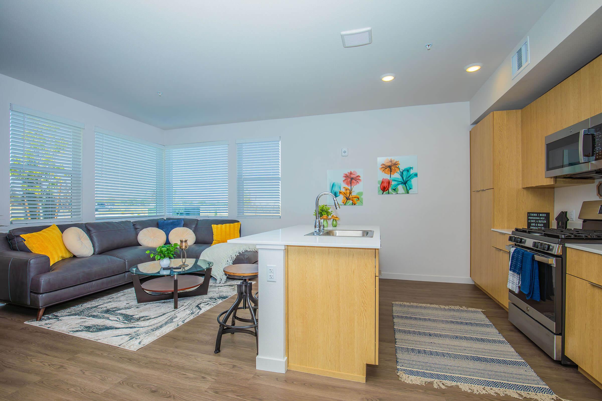 a living room filled with furniture and a flat screen tv