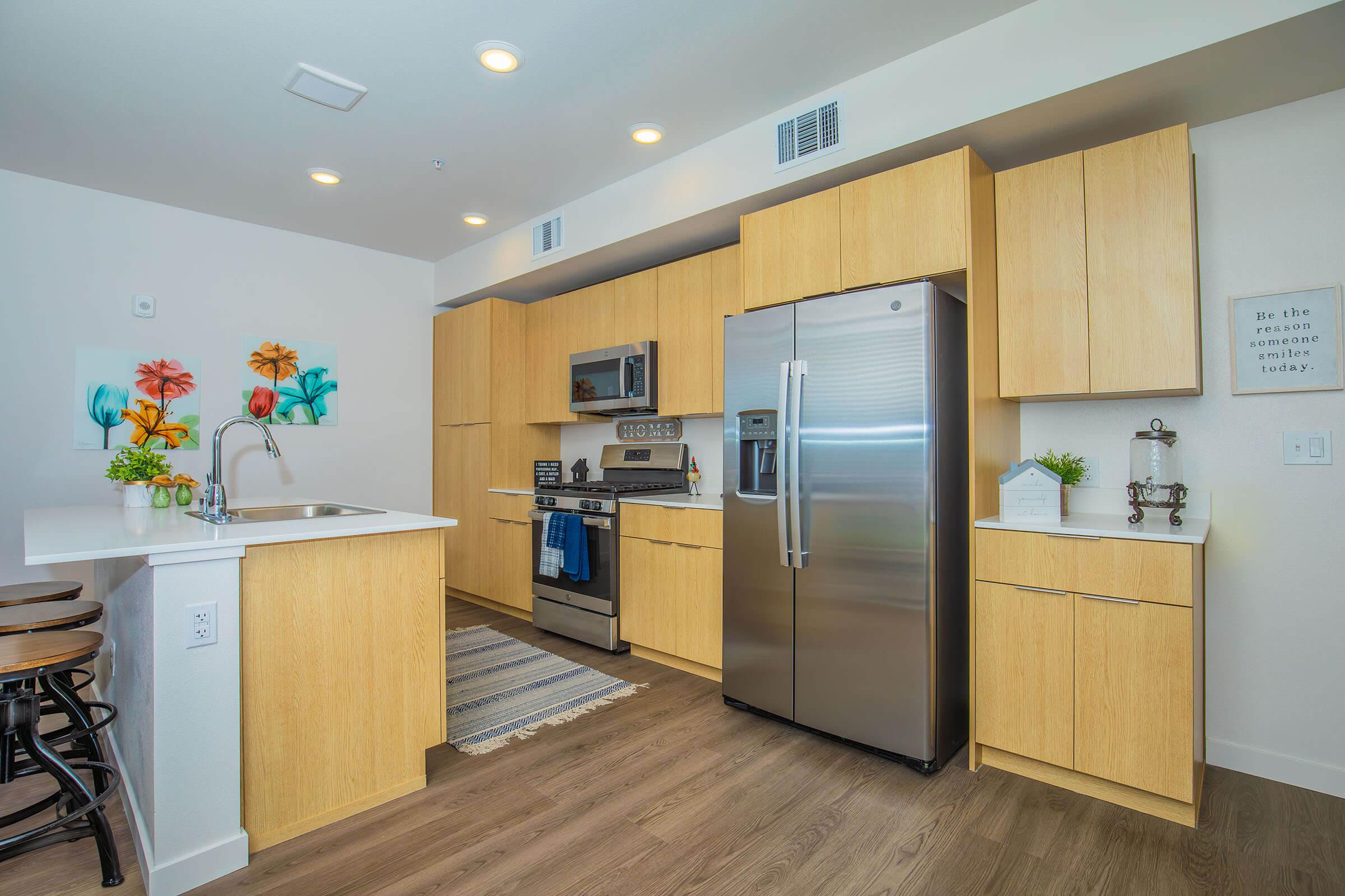 a kitchen with a refrigerator in a room