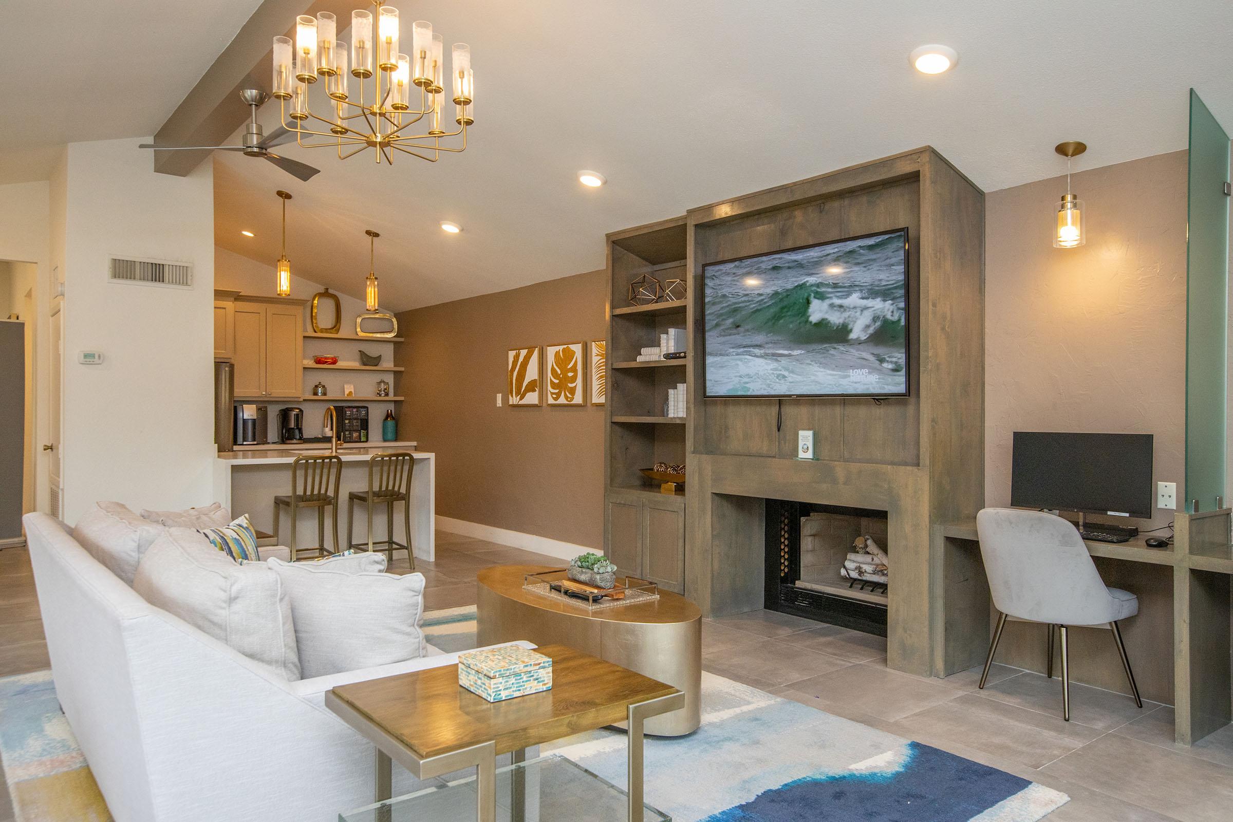 a living room filled with furniture and a fireplace