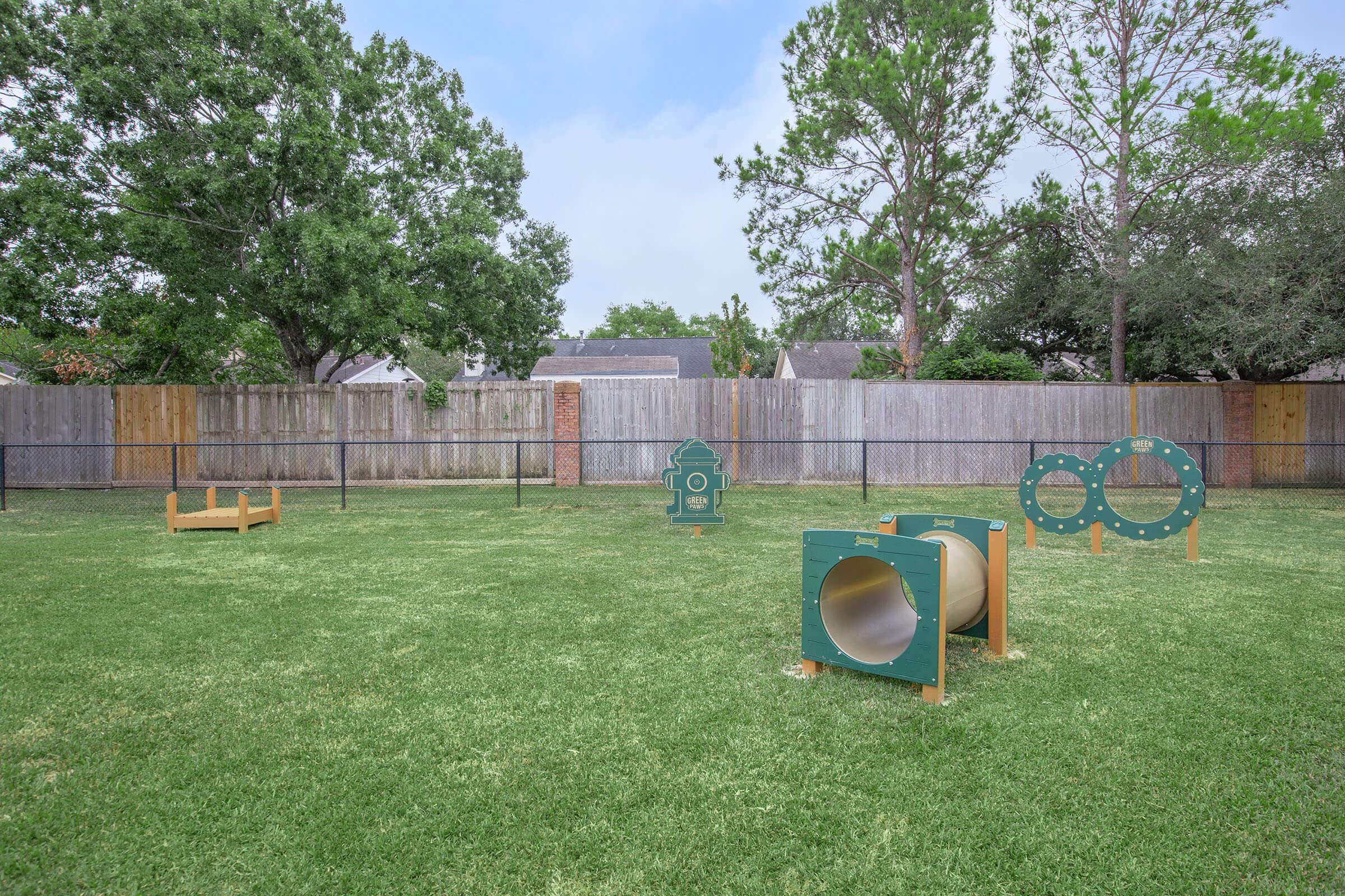 a yard with grass and trees