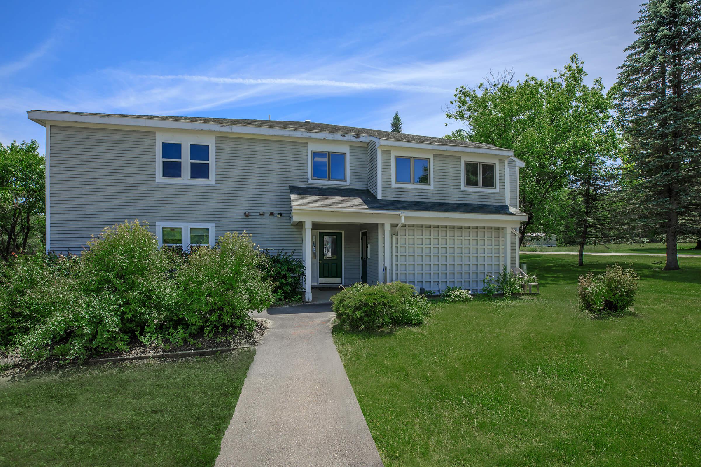 a large lawn in front of a house