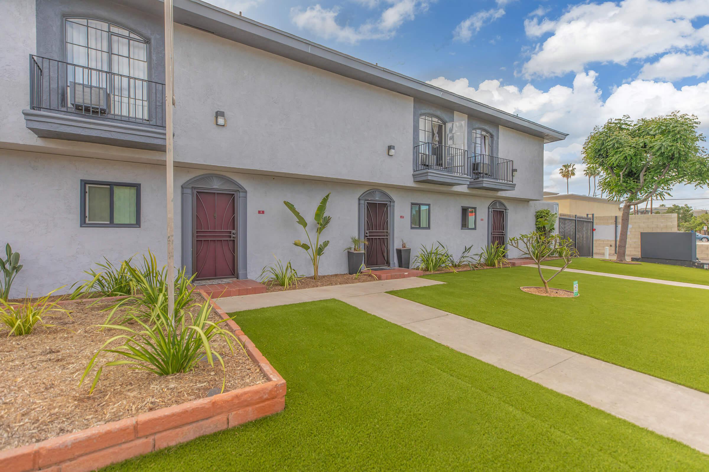 A community building with green grass