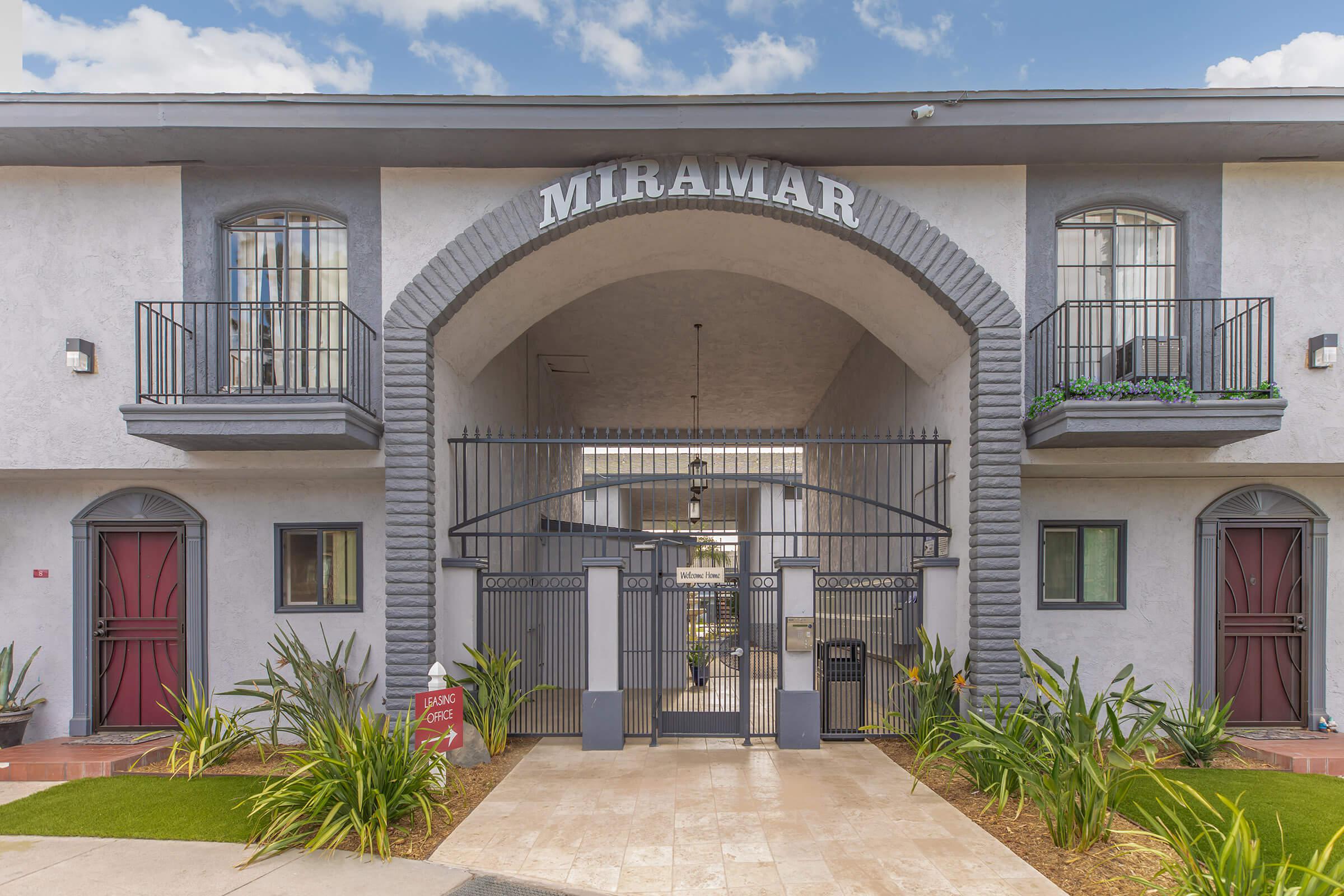 Miramar Apartments entrance with green plants