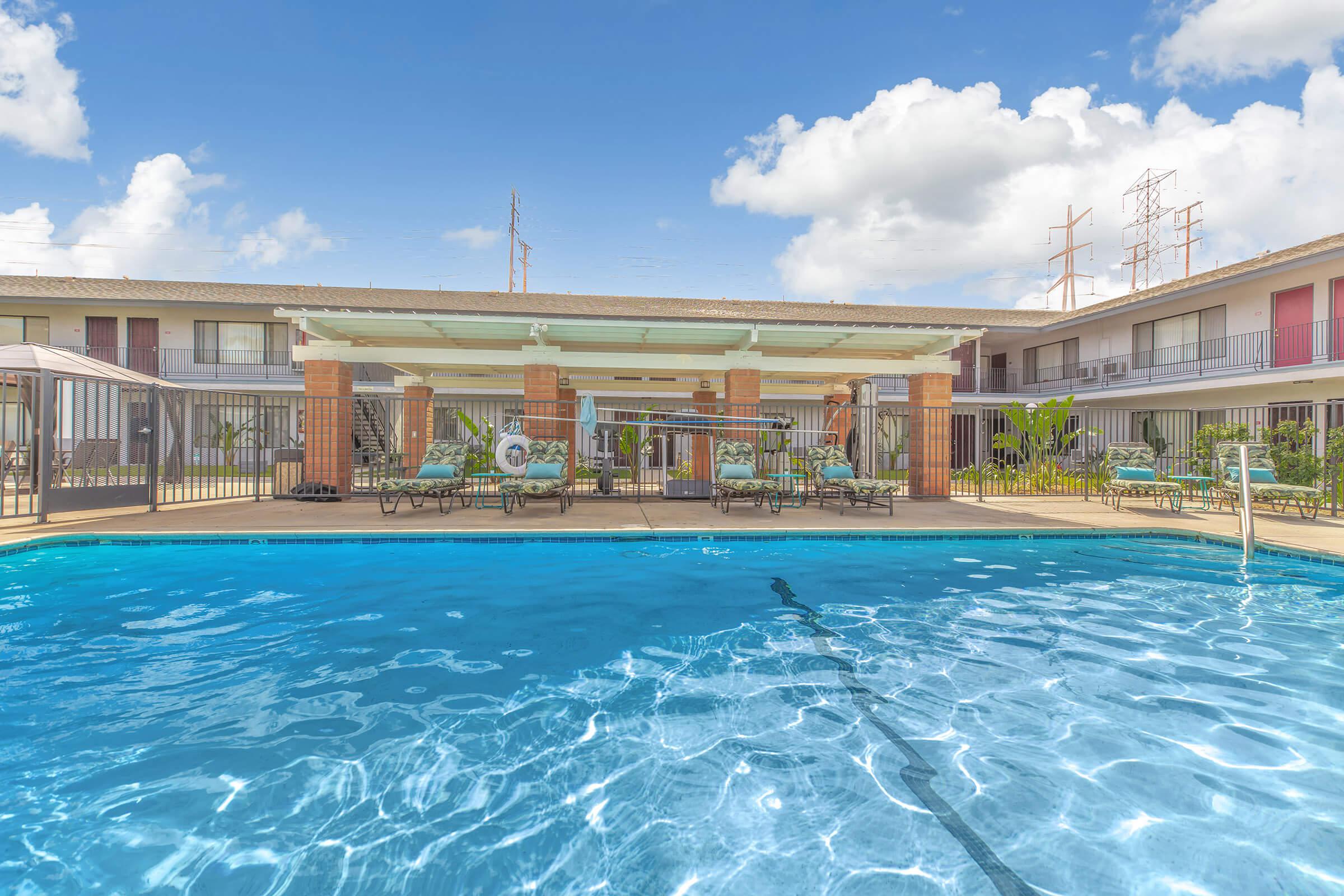 Miramar Apartments community pool with pavillion