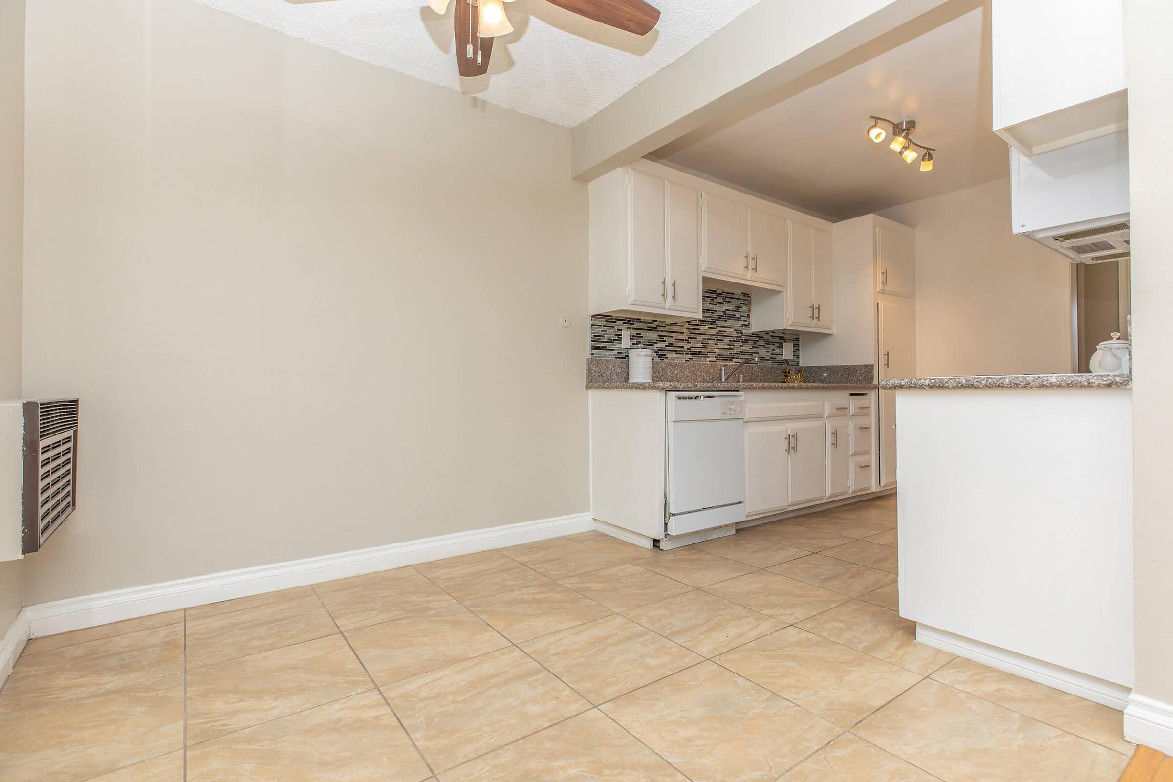 Dining room and kitchen with tile flooring