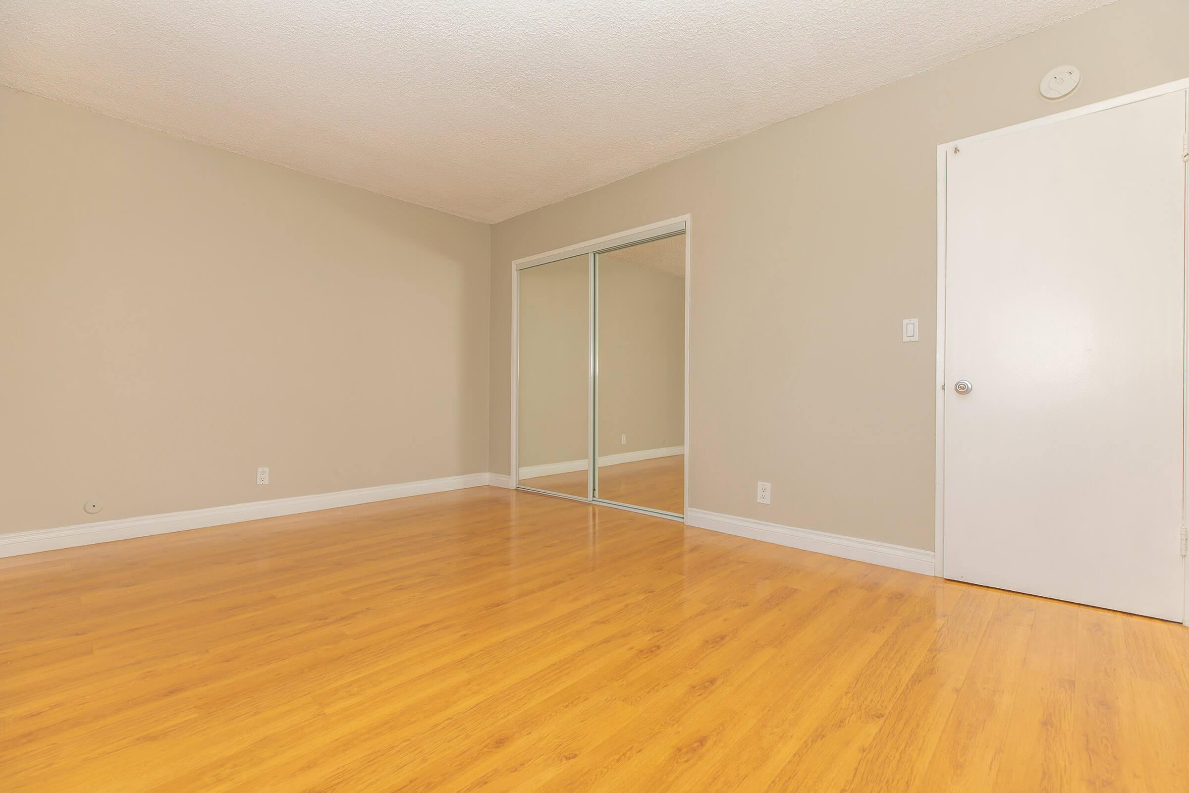 Bedroom with glass sliding closet doors