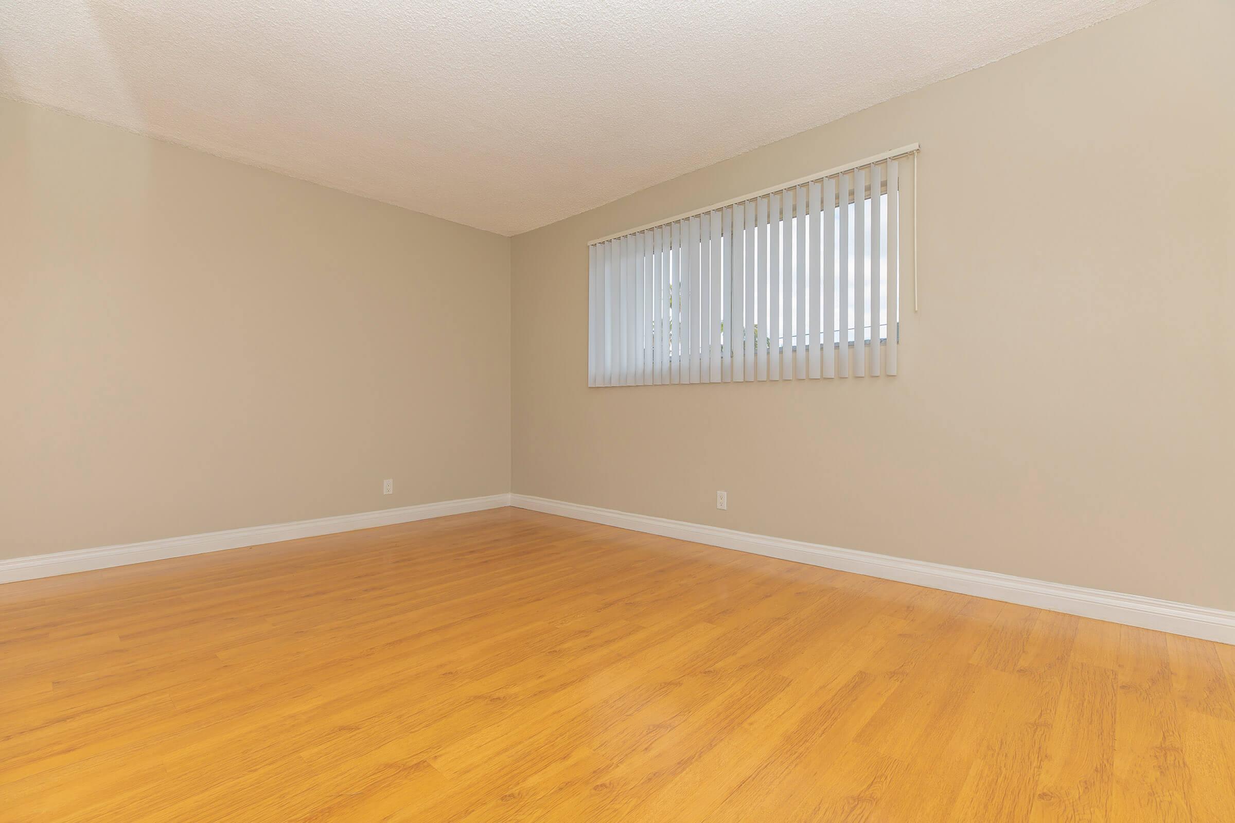 Vacant bedroom with white blinds