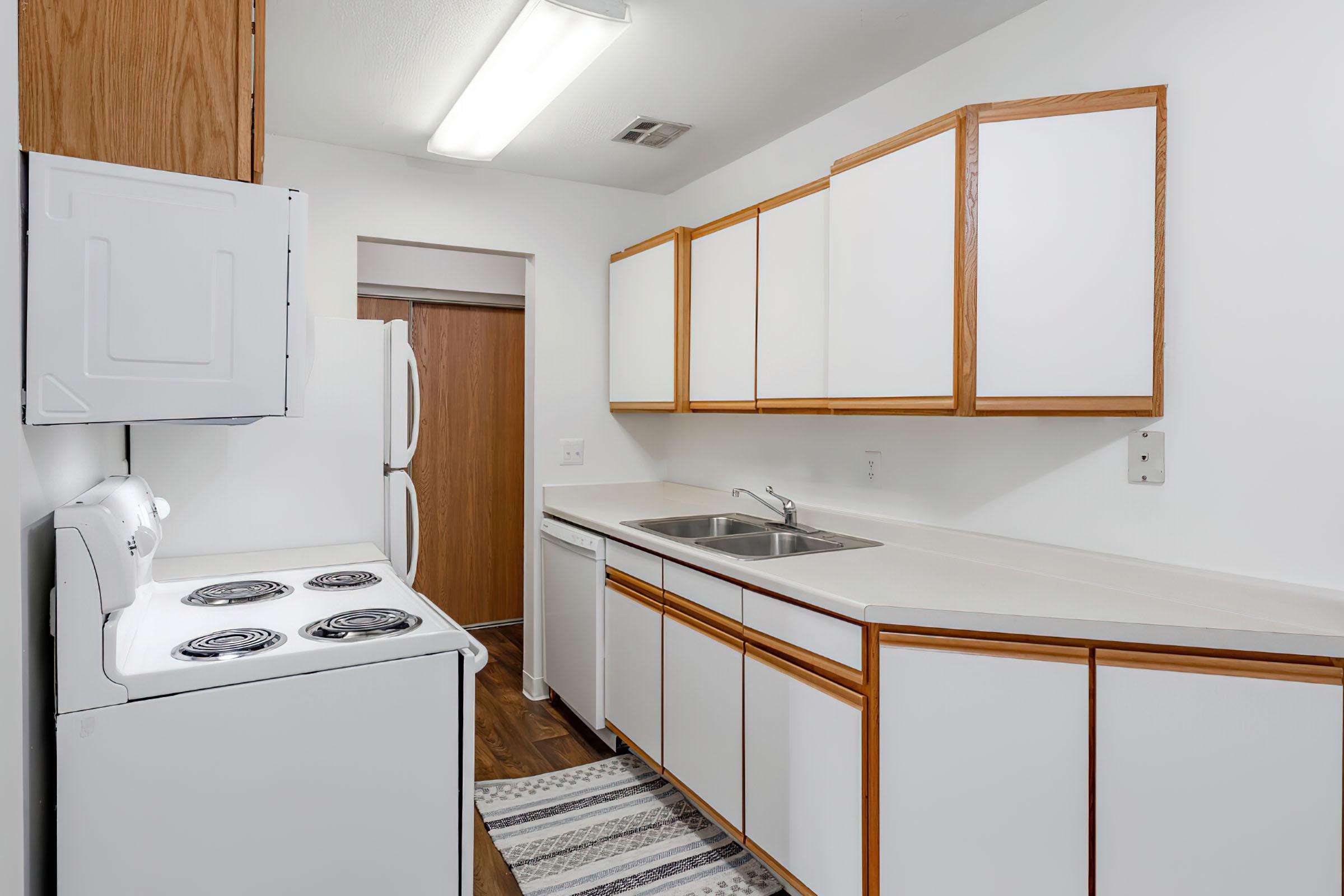 a kitchen with a sink and a microwave