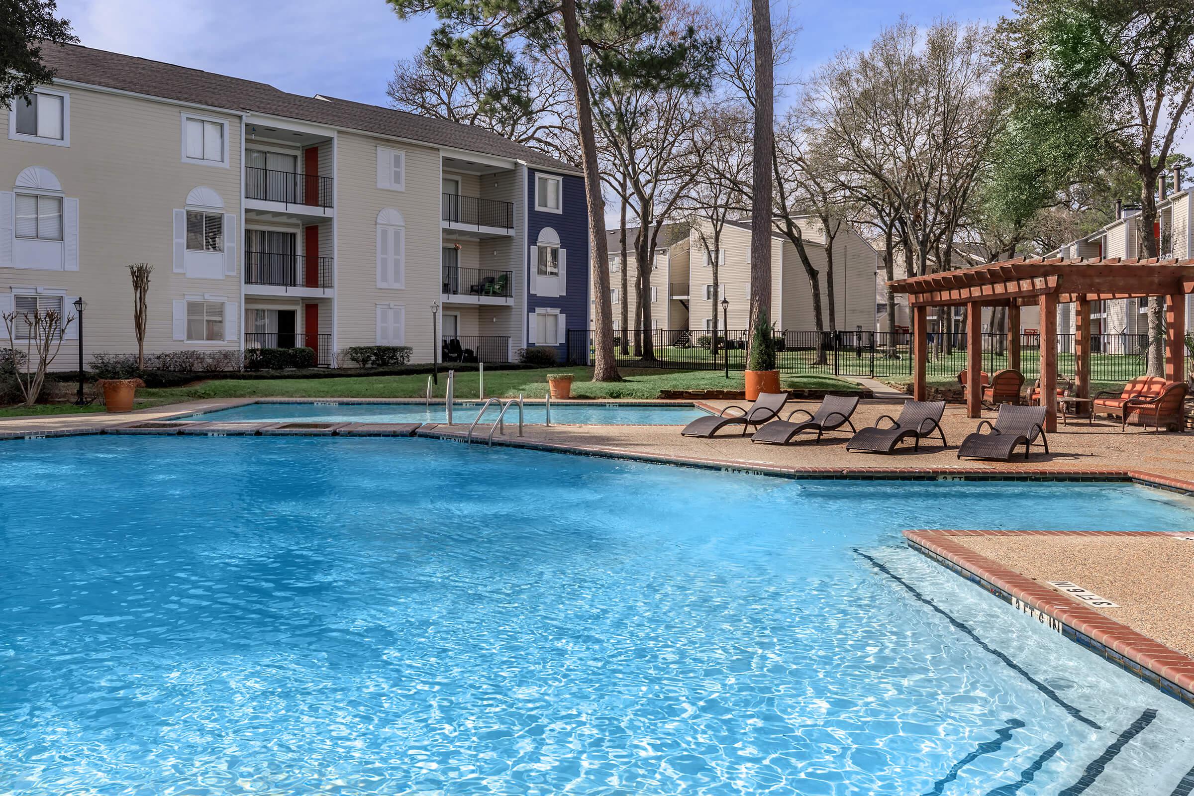 THE POOL AT THE 910 APARTMENT HOMES