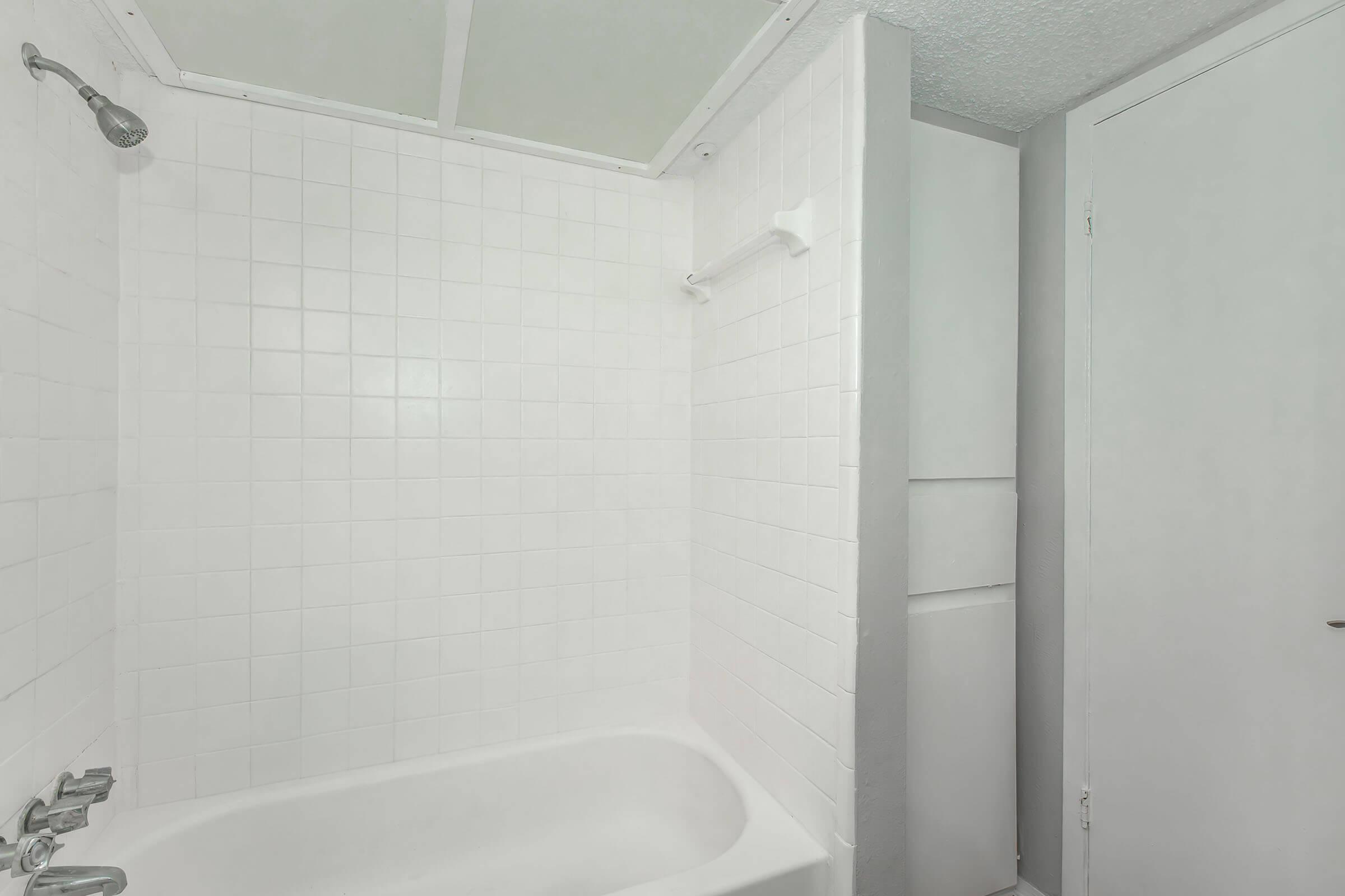 a room with a sink and a bath tub