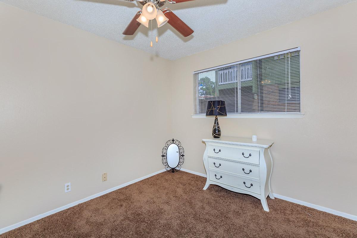 a bedroom with a large window