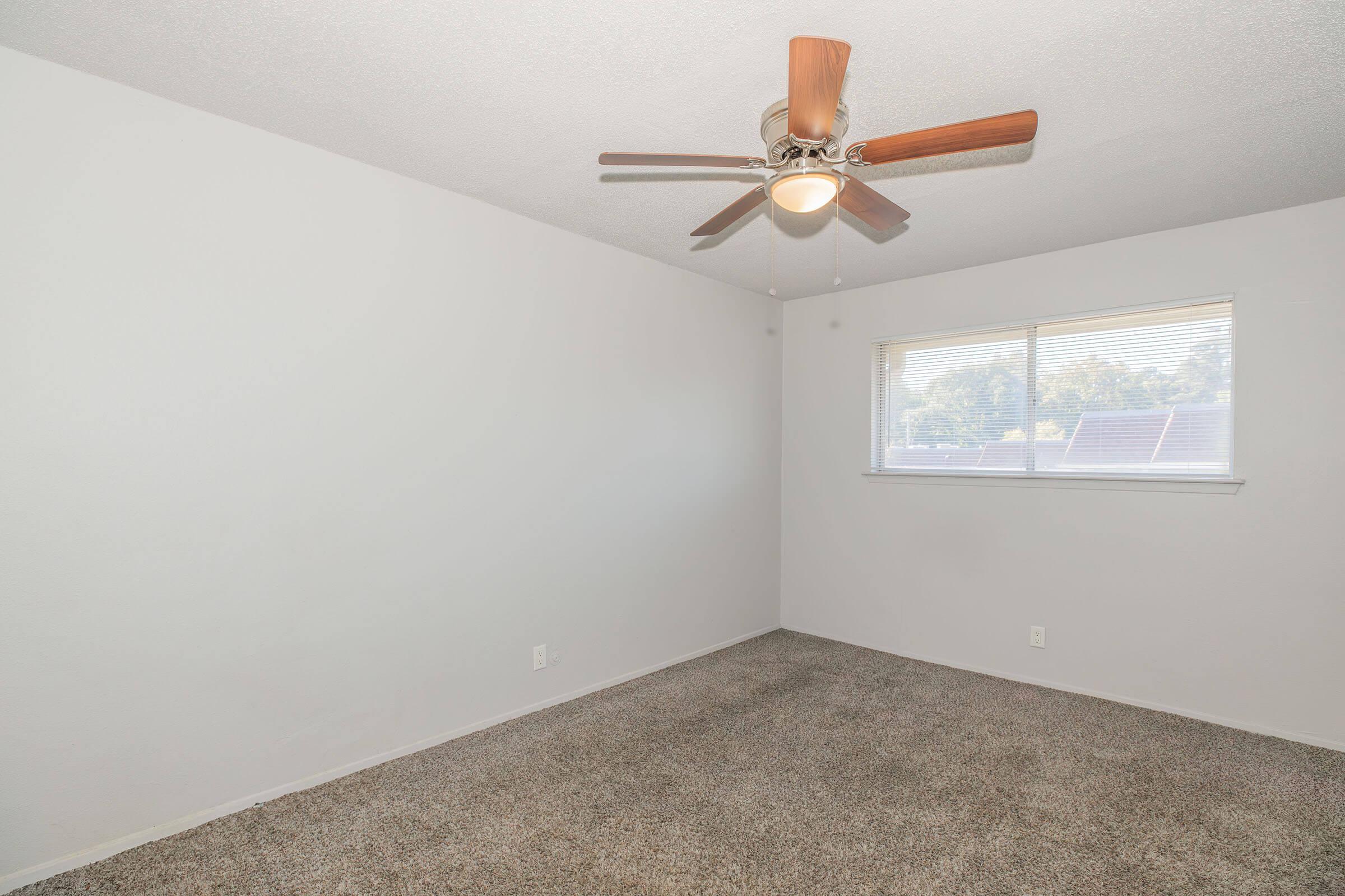 a bedroom with a small window