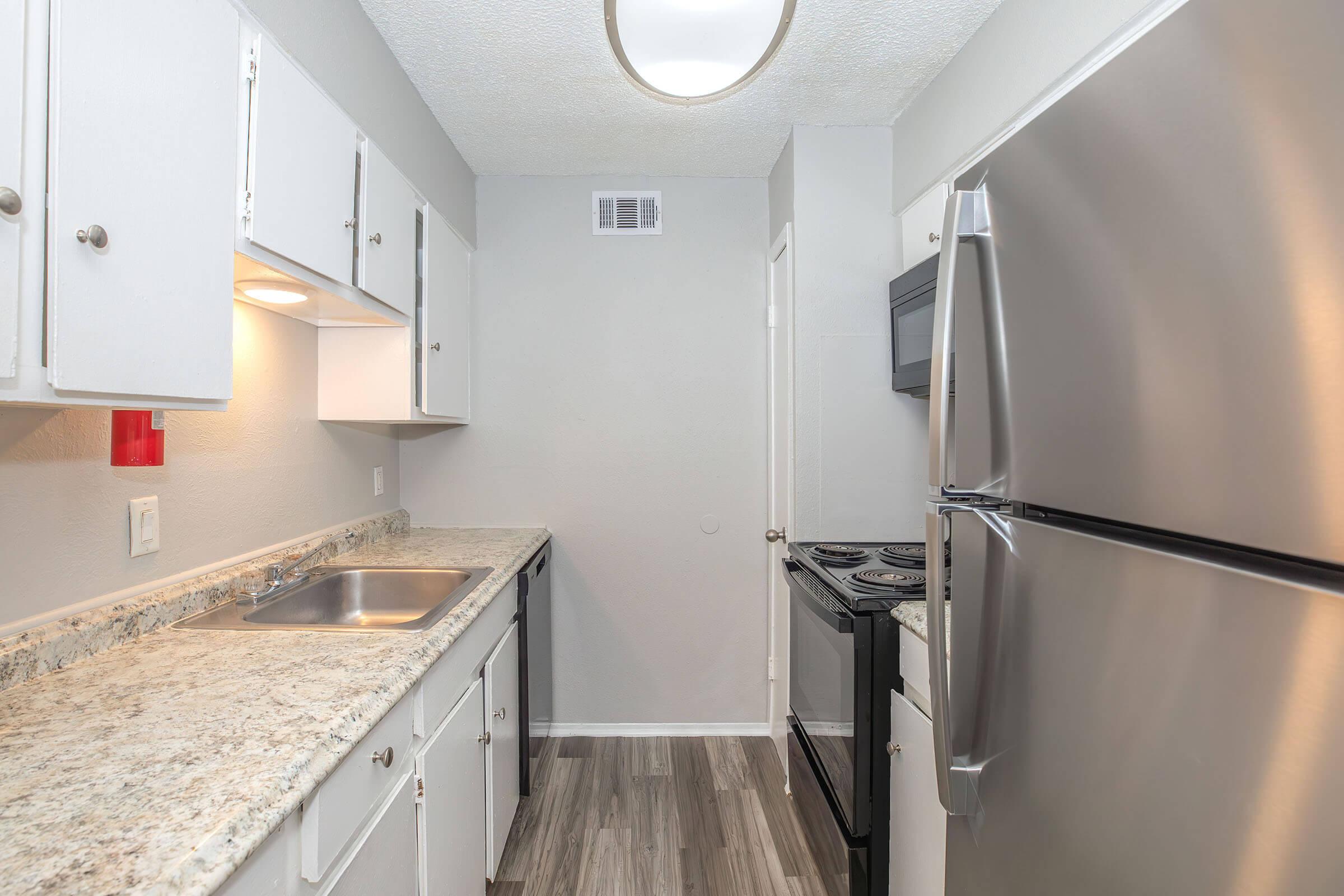 a stainless steel refrigerator in a kitchen