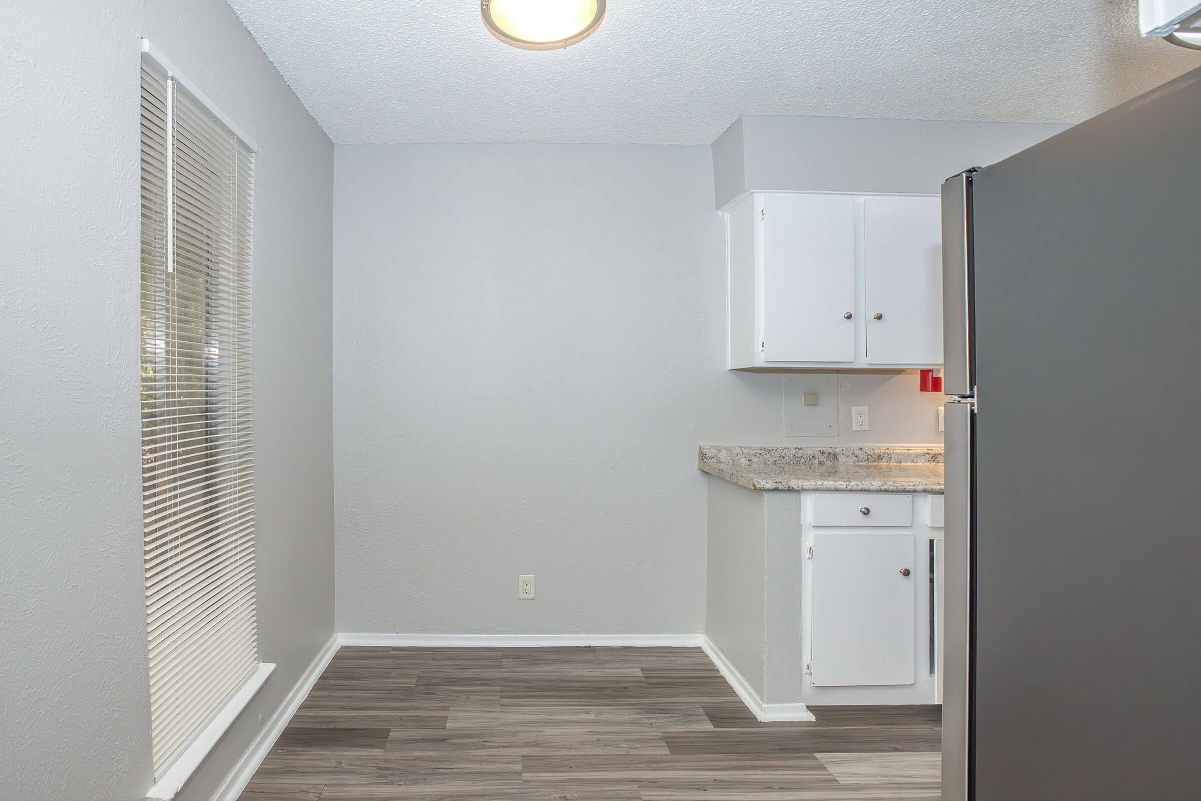 a kitchen with a sink and a refrigerator