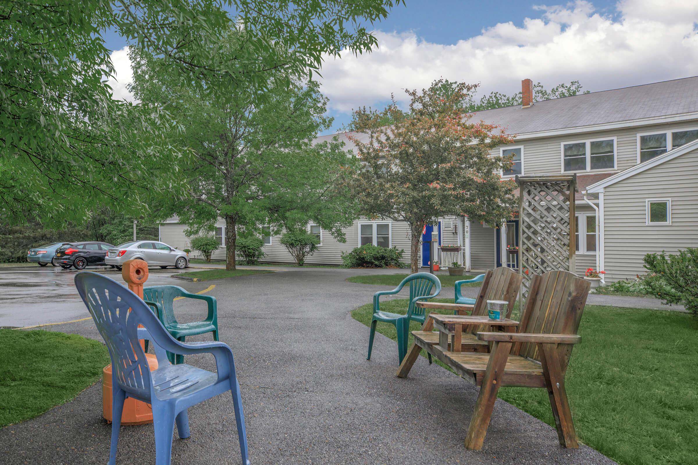 a couple of lawn chairs sitting on top of a picnic table