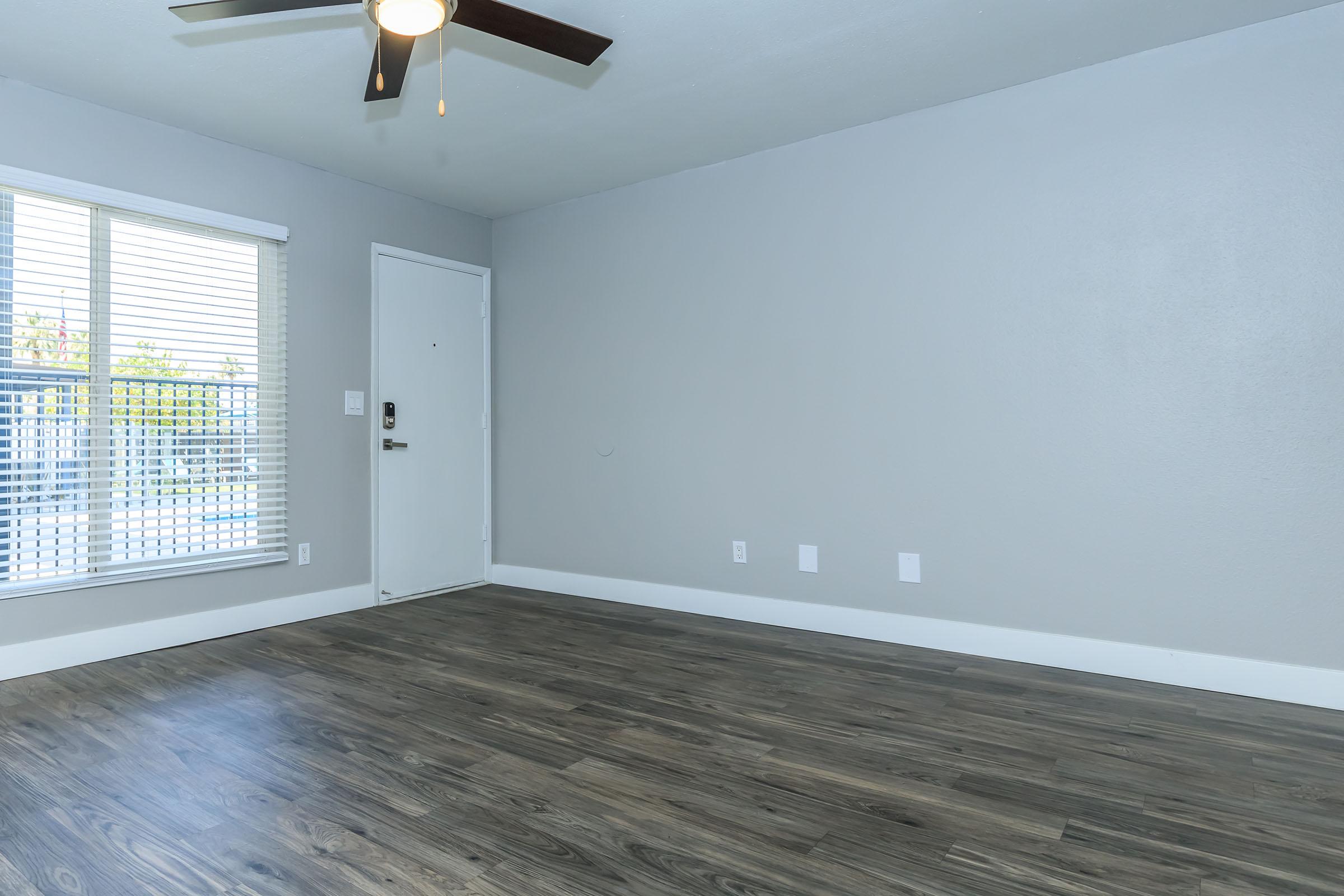 Apartment entryway next to a large window at Rise at the Lofts.