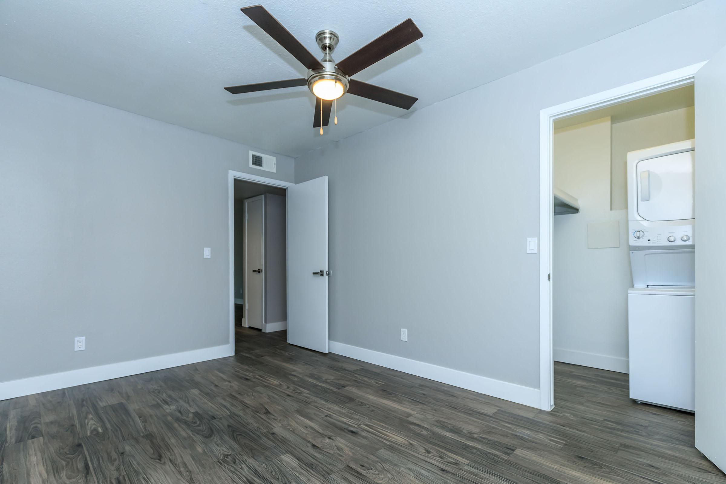 A room at Rise at the Loft with a separate closet with a washer and dryer. 