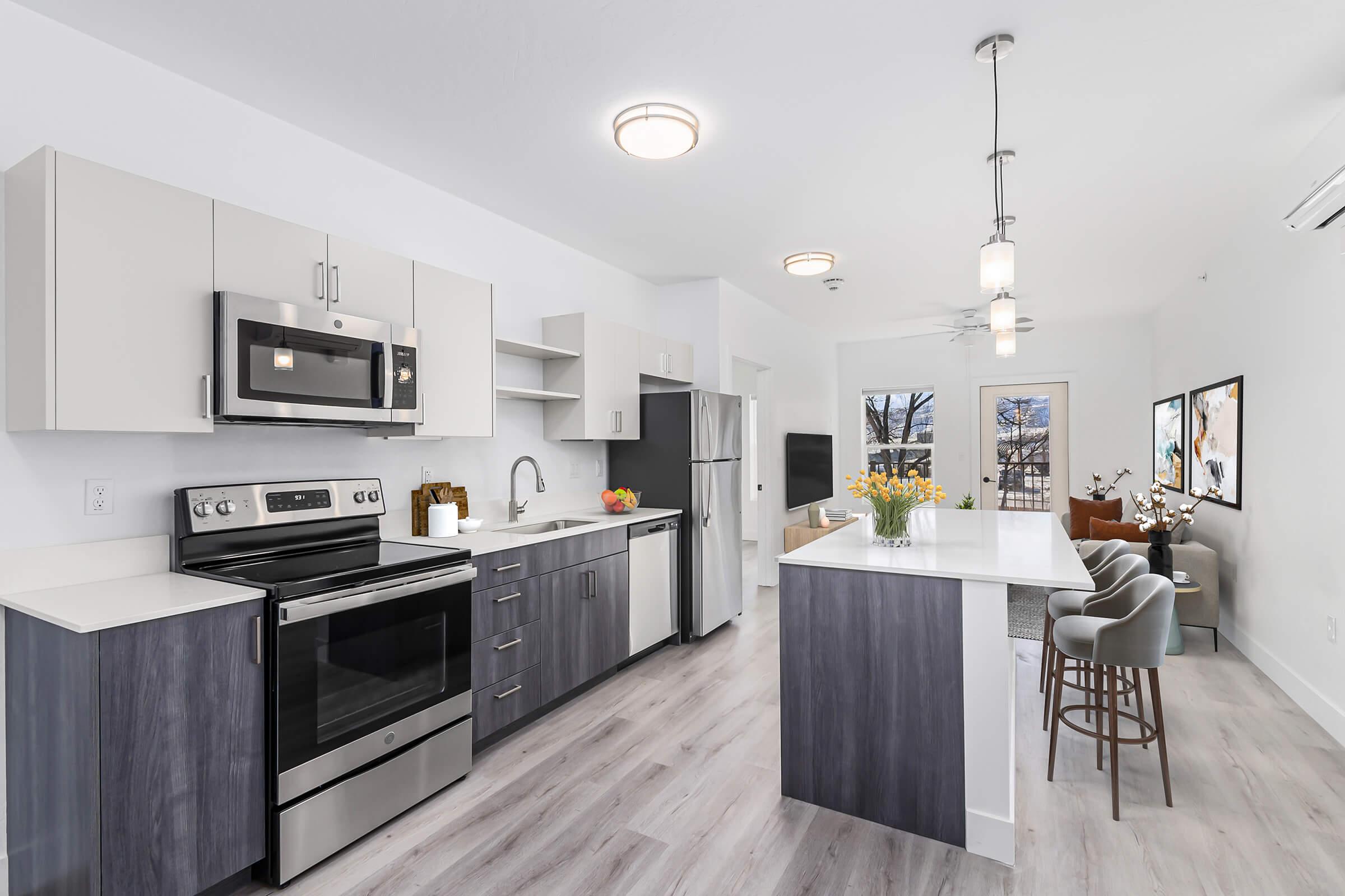 a large kitchen with stainless steel appliances