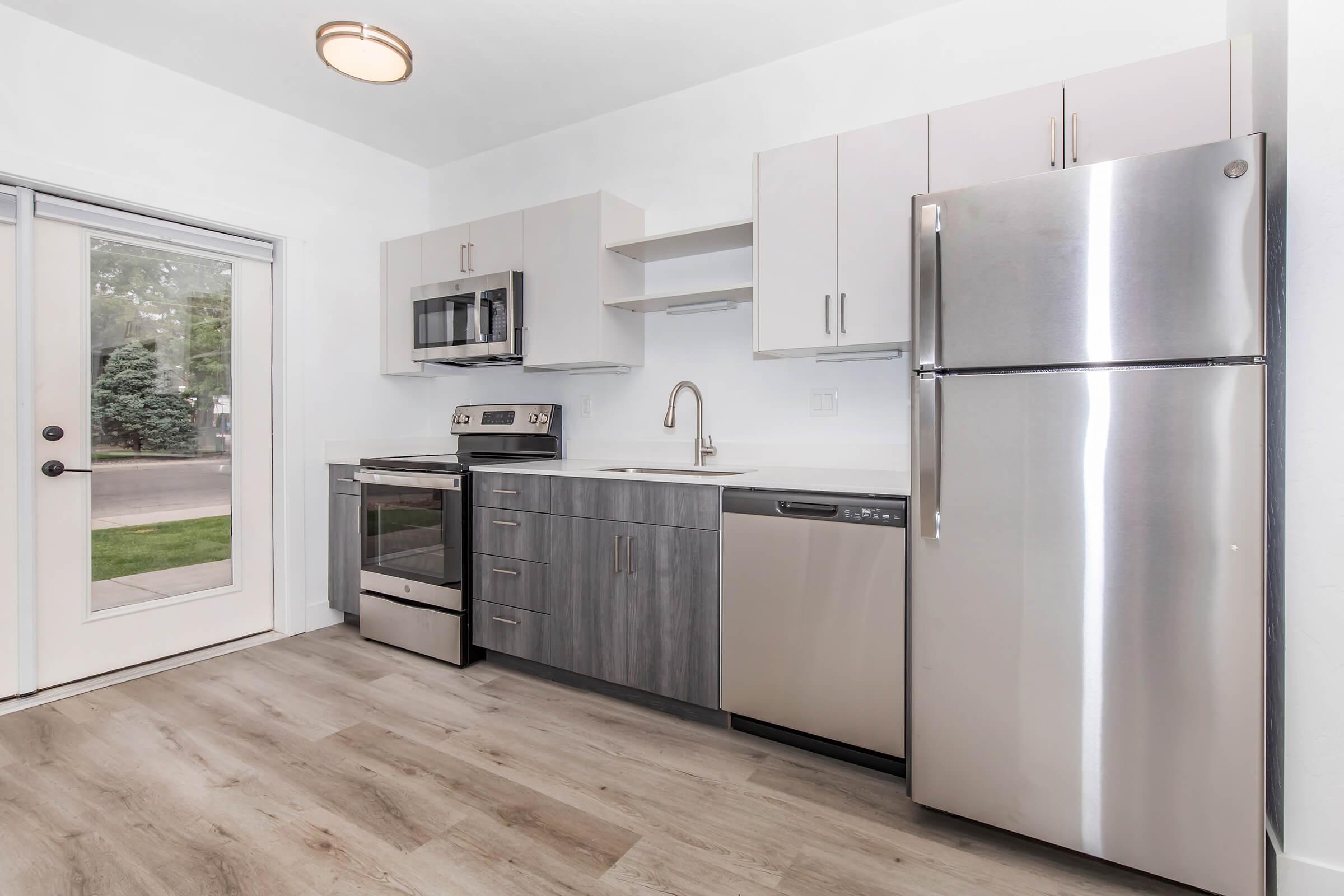 a stainless steel refrigerator in a kitchen