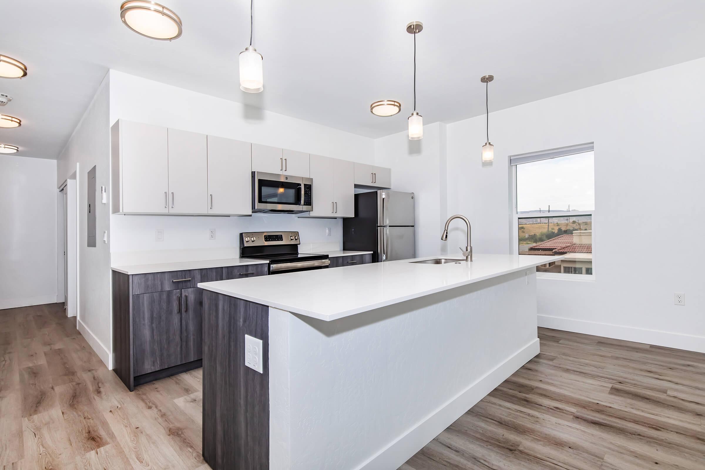 a kitchen with a wood floor