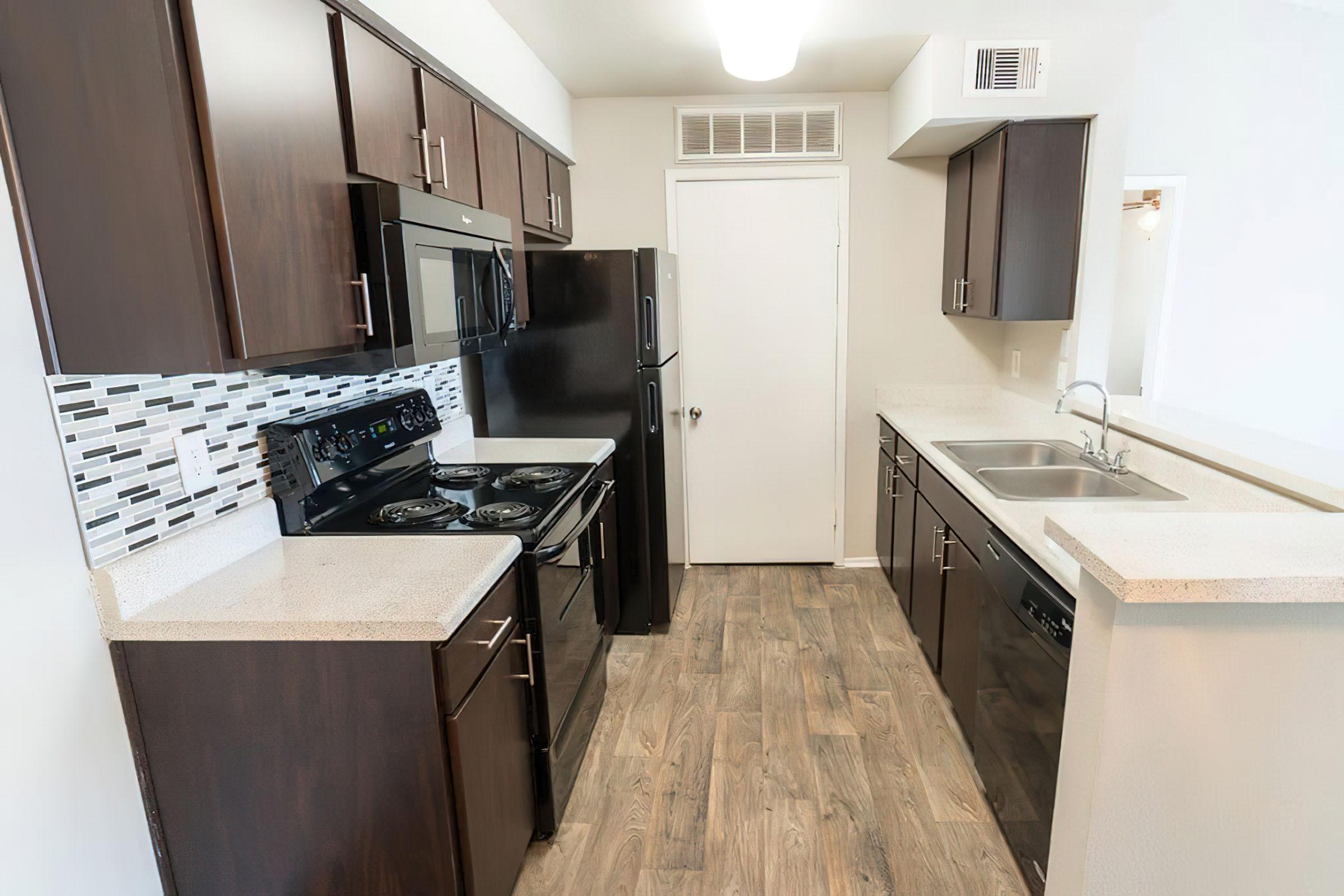 a stainless steel refrigerator in a kitchen