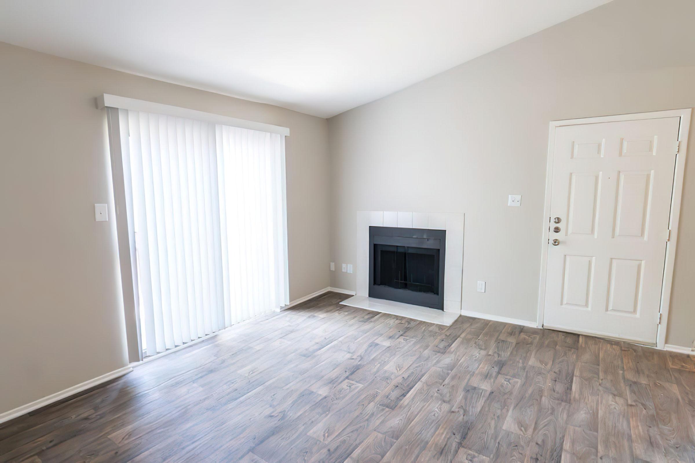 a large empty room with a wooden floor