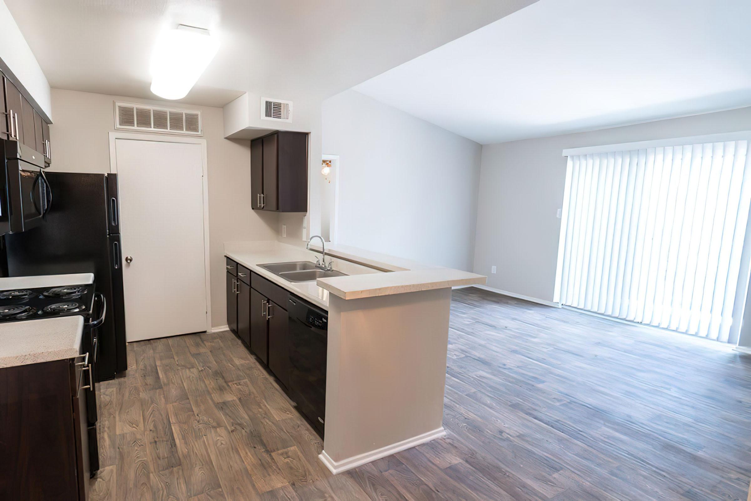 a kitchen with a wood floor