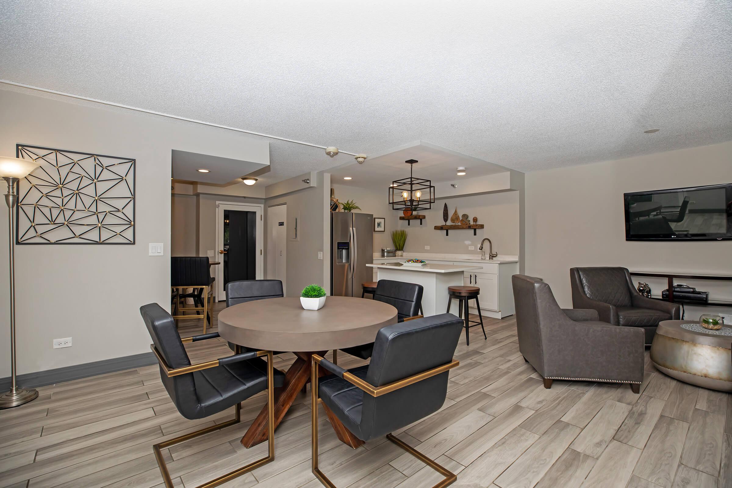 a living room filled with furniture and a flat screen tv