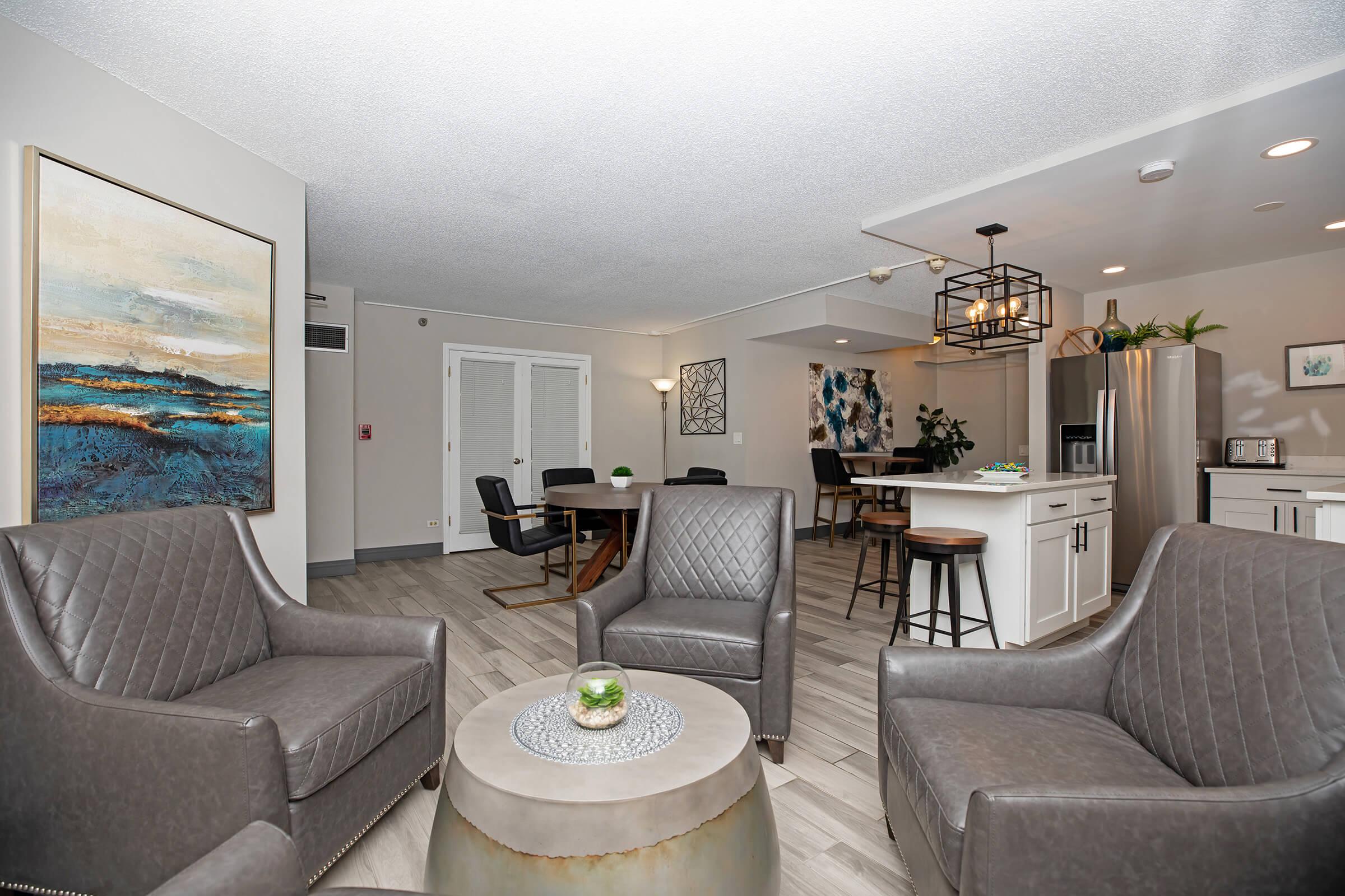 a living room filled with furniture and a flat screen tv